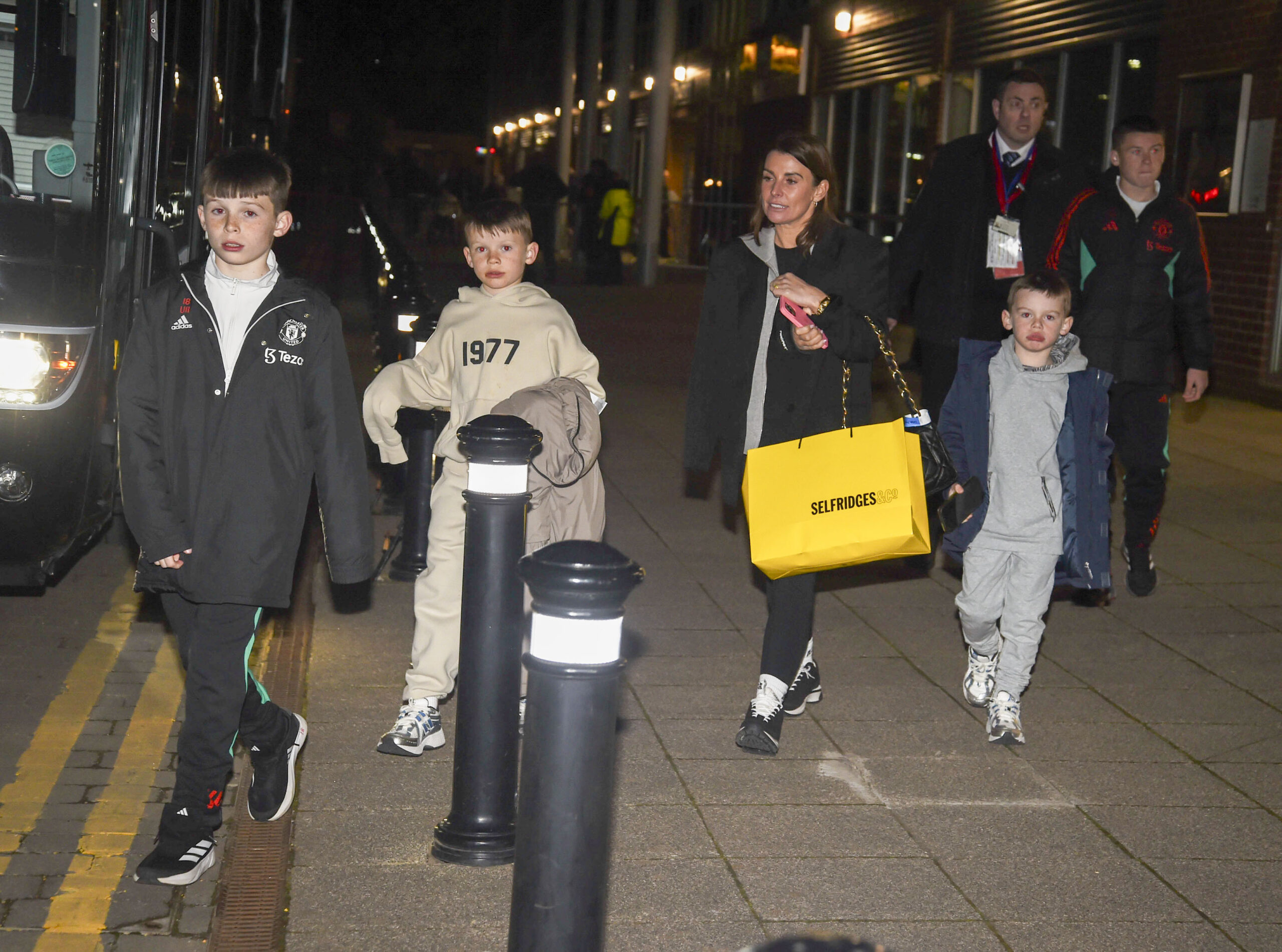 Coleen Rooney and her sons at night in Lancashire