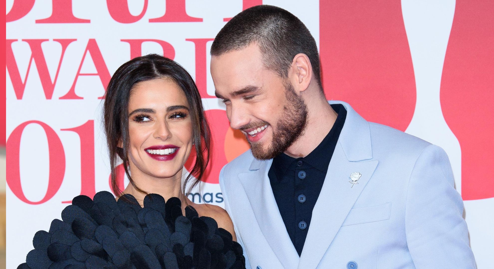 Liam Payne and Cheryl smiling on the red carpet 
