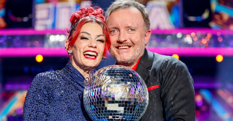 Dianne Buswell and Chris McCausland holding the Strictly trophy