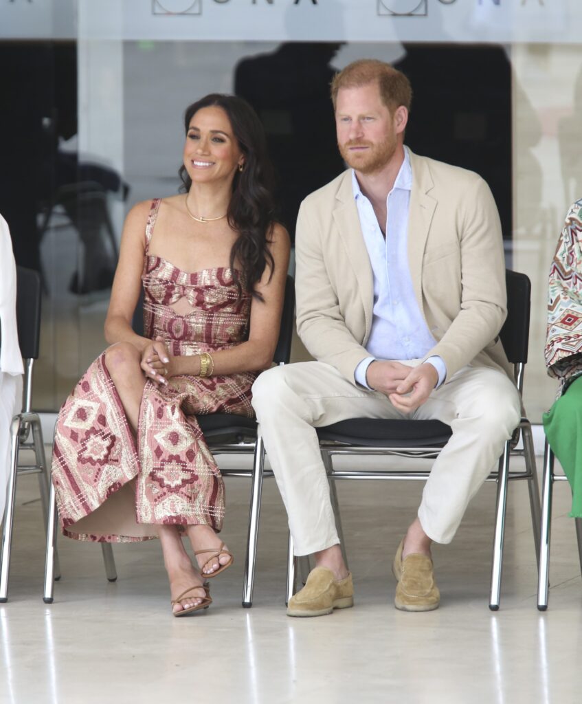 Meghan Markle and Prince Harry sitting down during Colombia trip