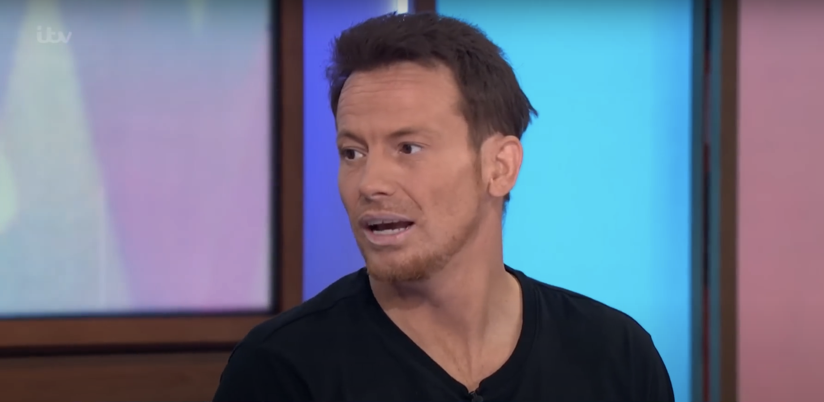 Joe Swash in a black T-shirt on Loose Women