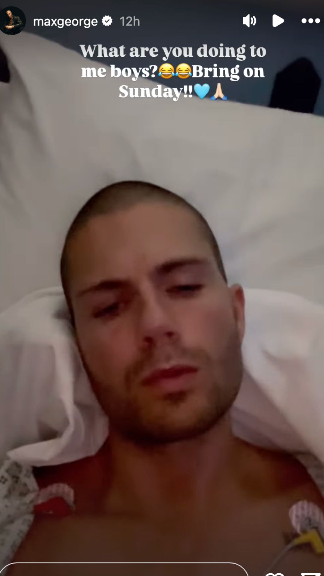 Max George frowning from his hospital bed with an exposed chest