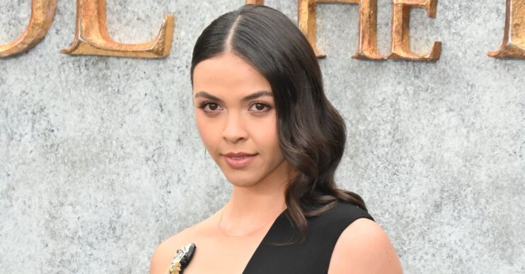 Vanessa Bauer posing in black dress at movie premiere