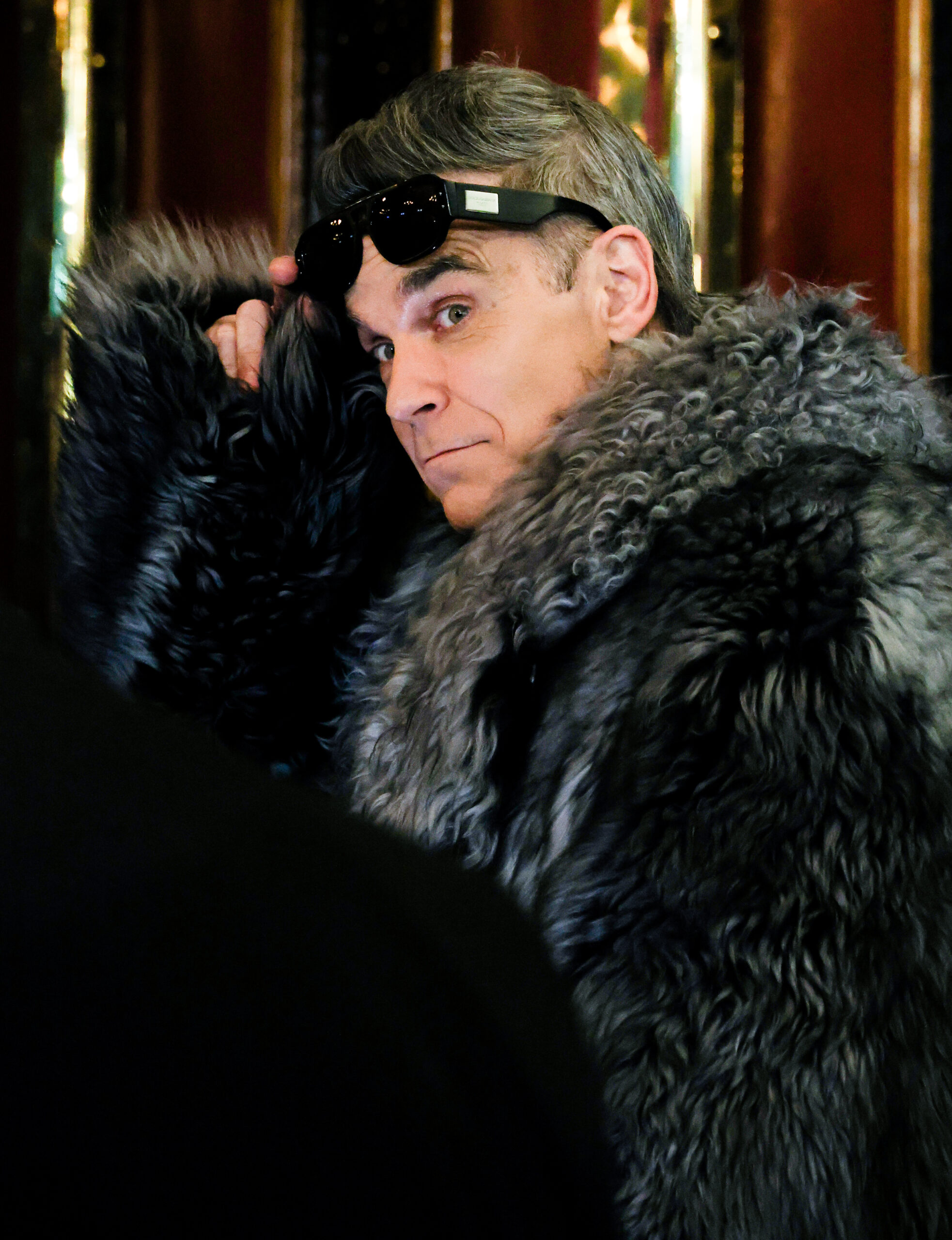 Robbie Williams wearing sunglasses