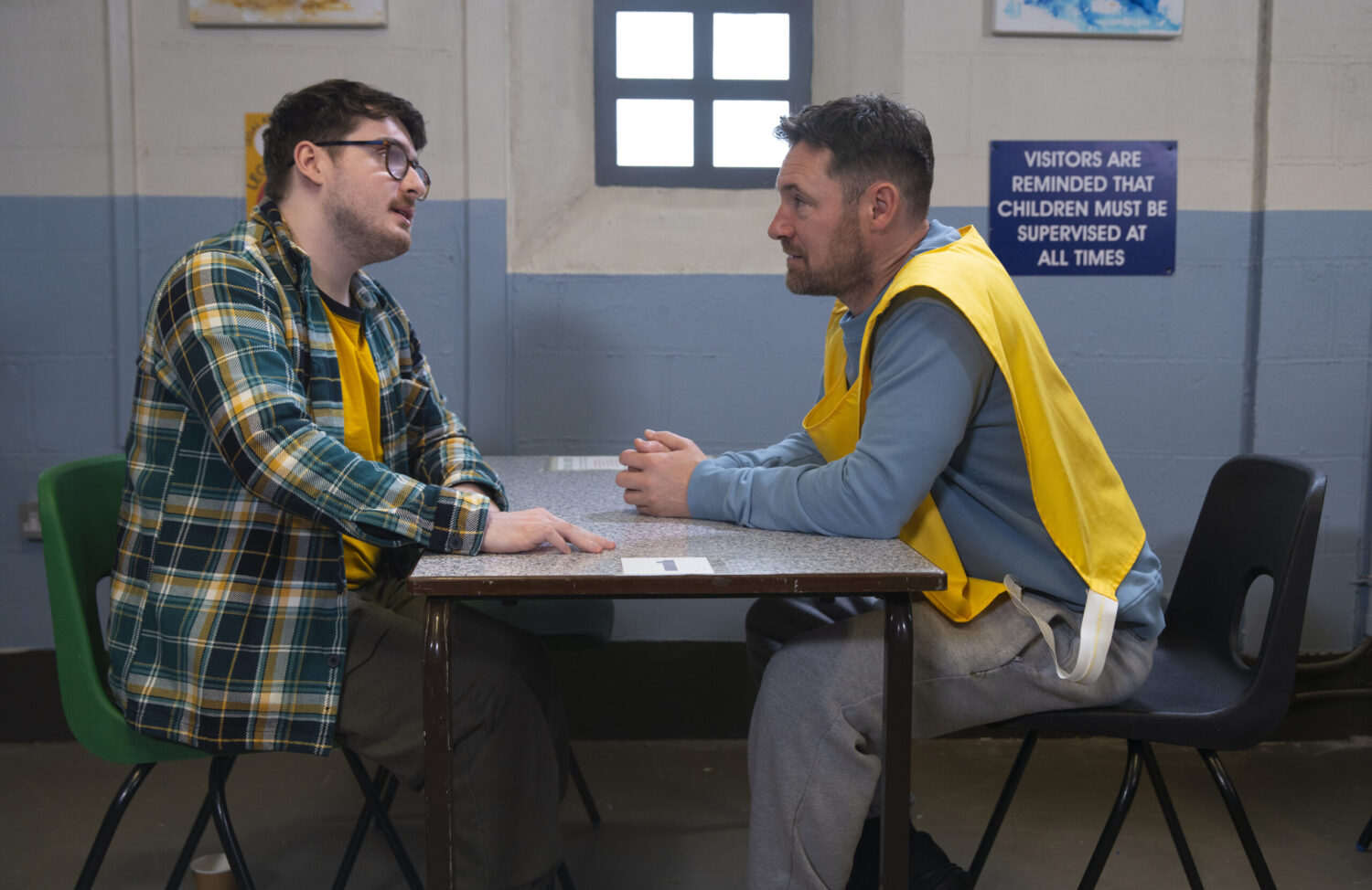Bobby and Rob talking in prison