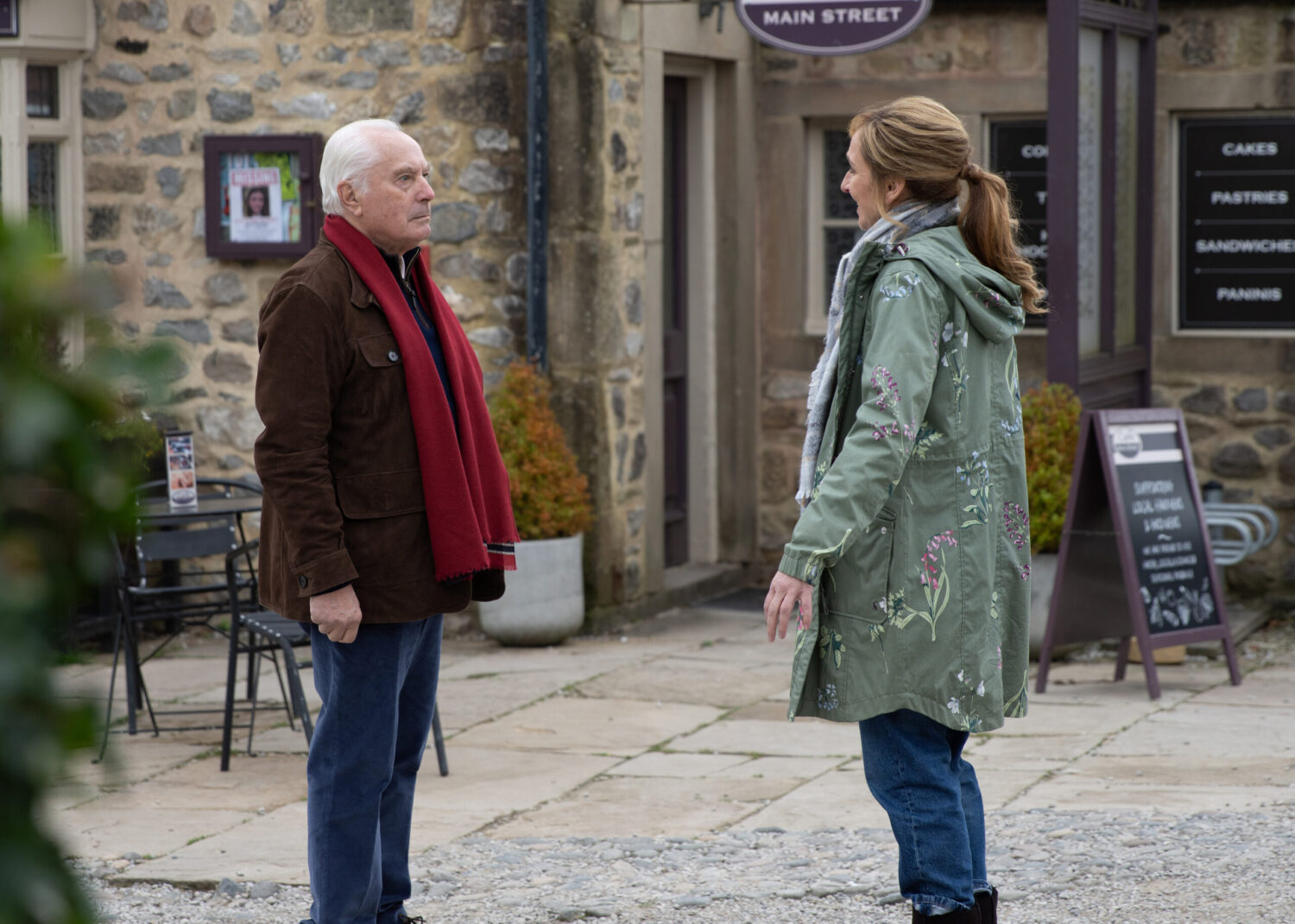 Anthony and Laurel talking outside