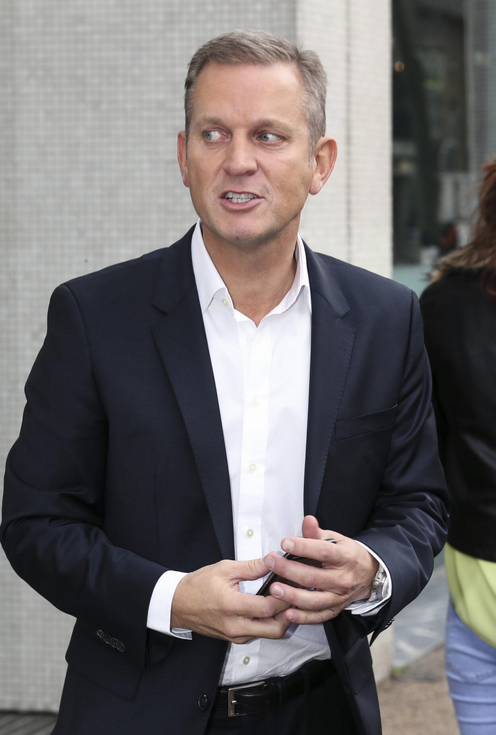 Jeremy Kyle in a white shirt and navy jacket