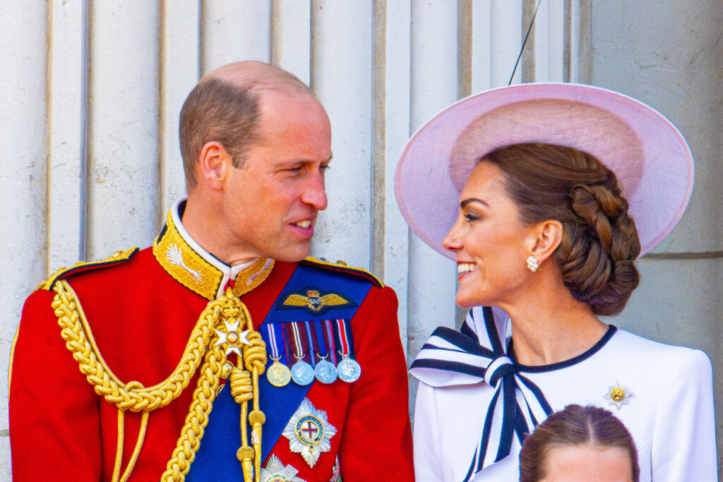Prince William and Princess Kate looking and smiling at each other during Trooping the Colour