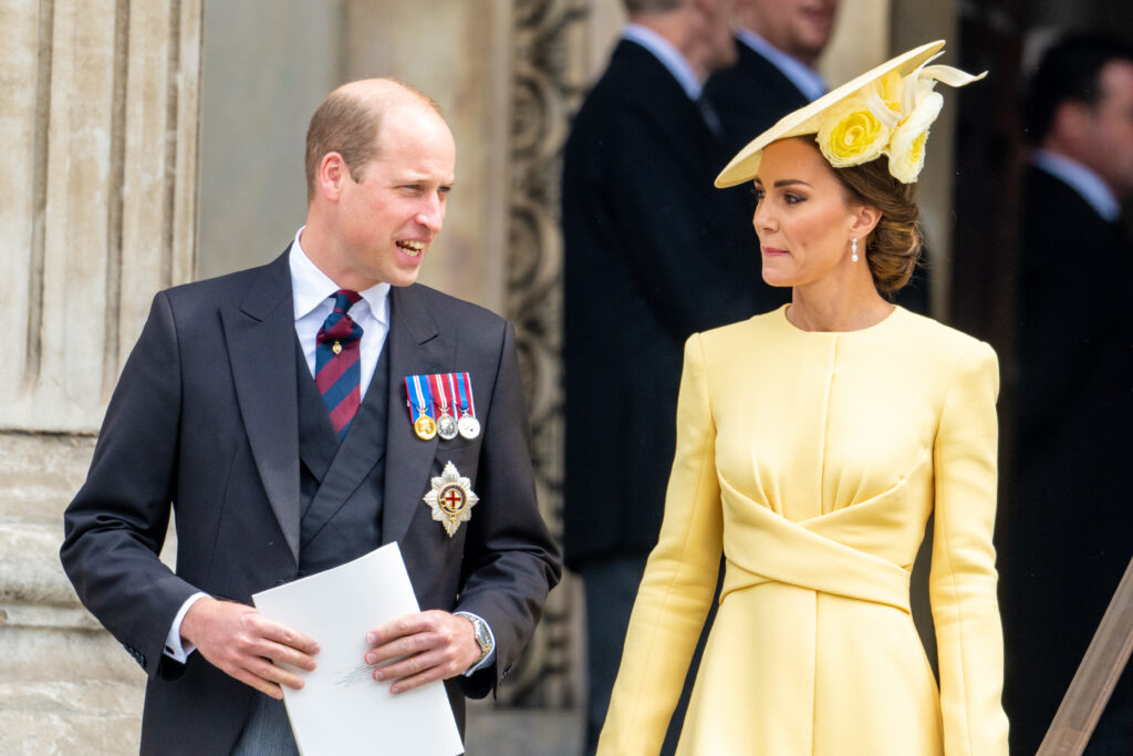 Prince William and Princess Kate talking to each other during royal service