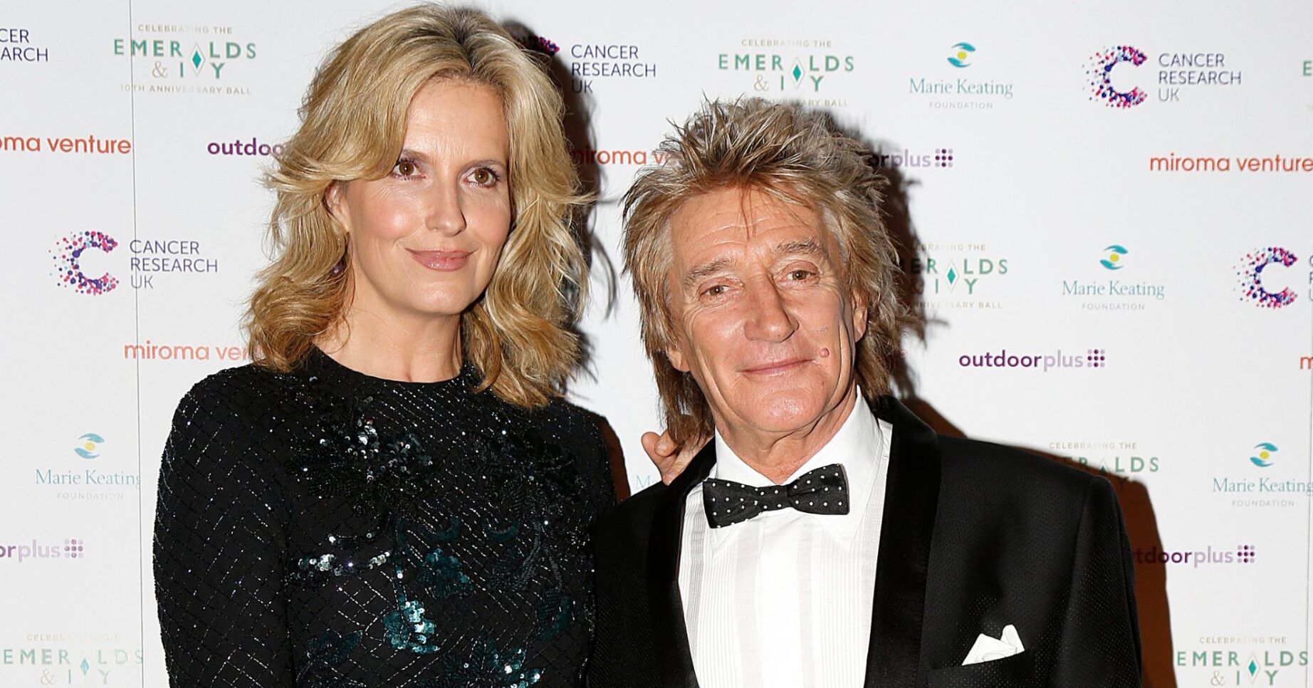 Rod Stewart and Penny Lancaster smile at the 10th Emeralds and Ivy Ball