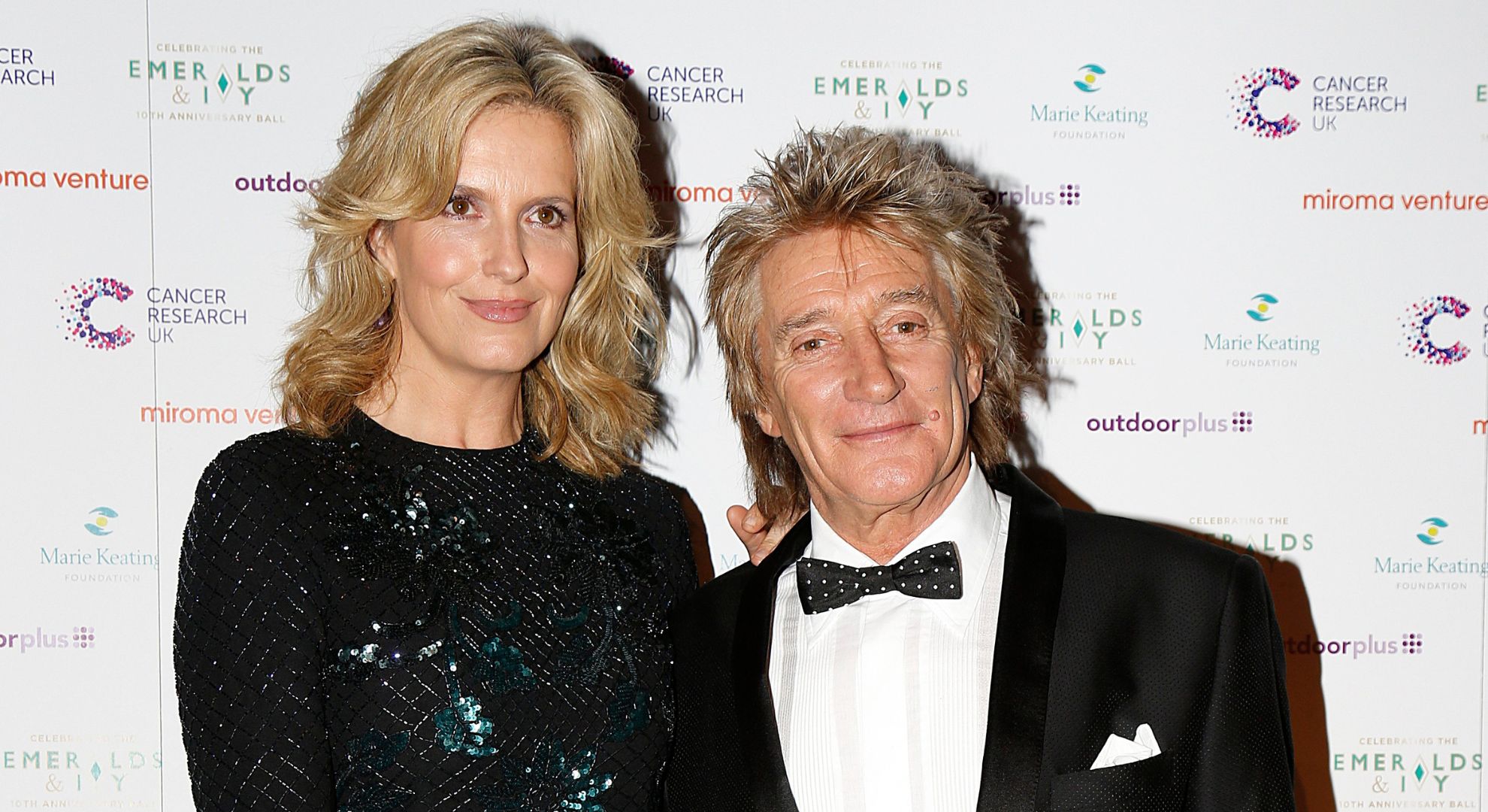 Rod Stewart and Penny Lancaster smile at the 10th Emeralds and Ivy Ball