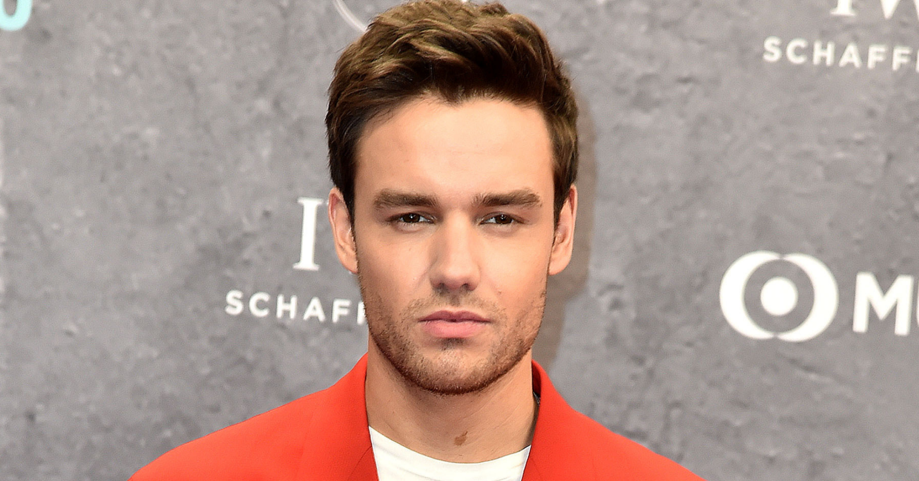 Liam PAyne in a red suit