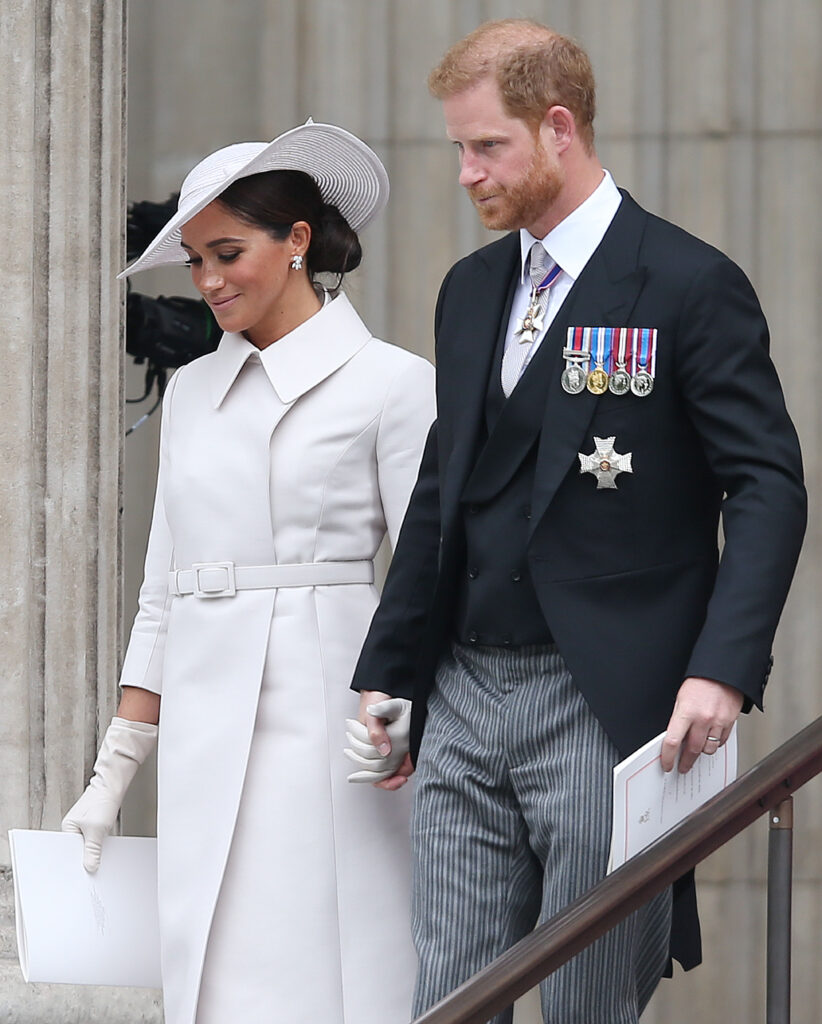 Meghan Markle and Prince Harry walking hand in hand after royal service