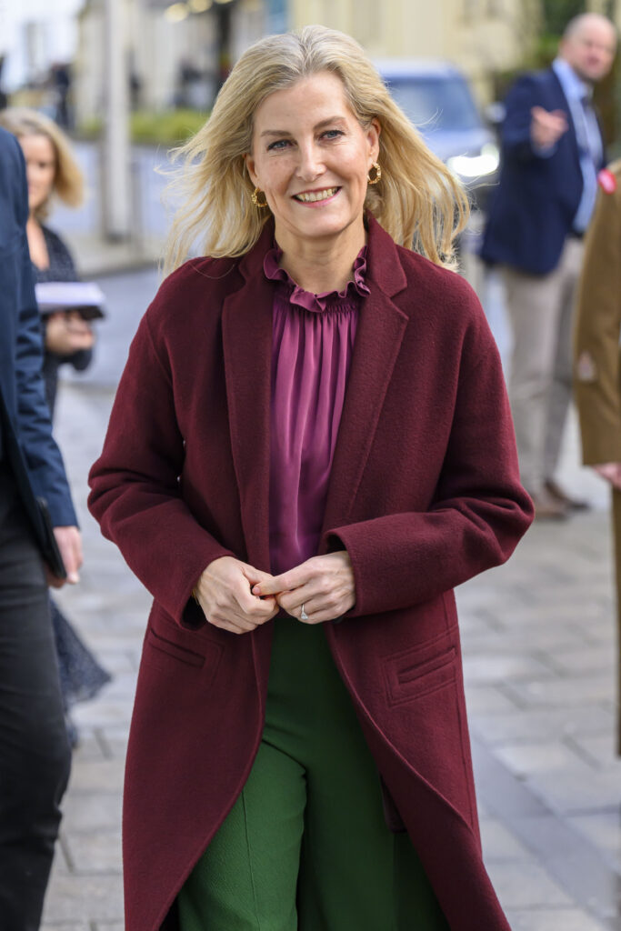 Sophie, Duchess of Edinburgh, smiling in burgundy coat during royal engagement
