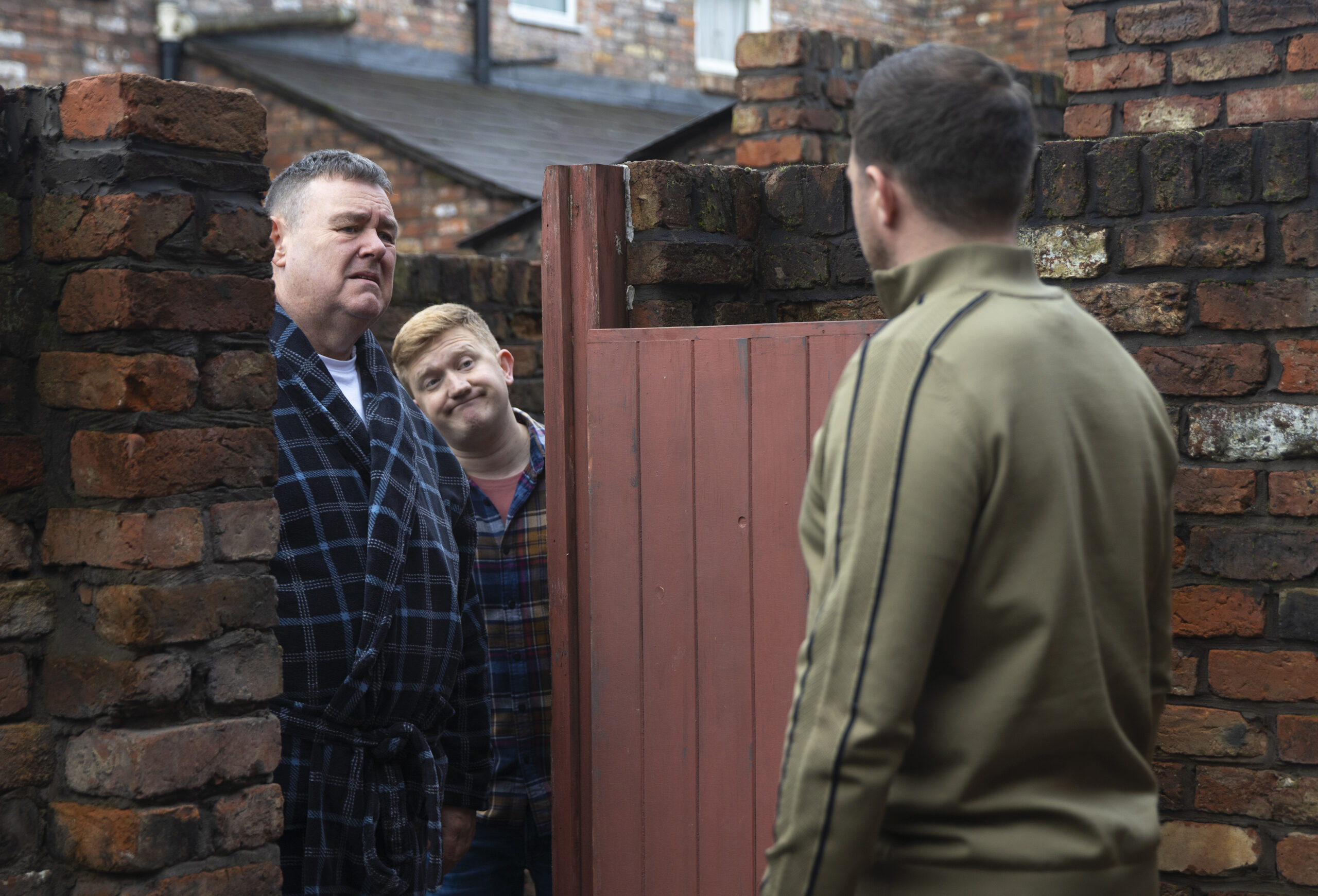 George, Chesney and Mick talking outside