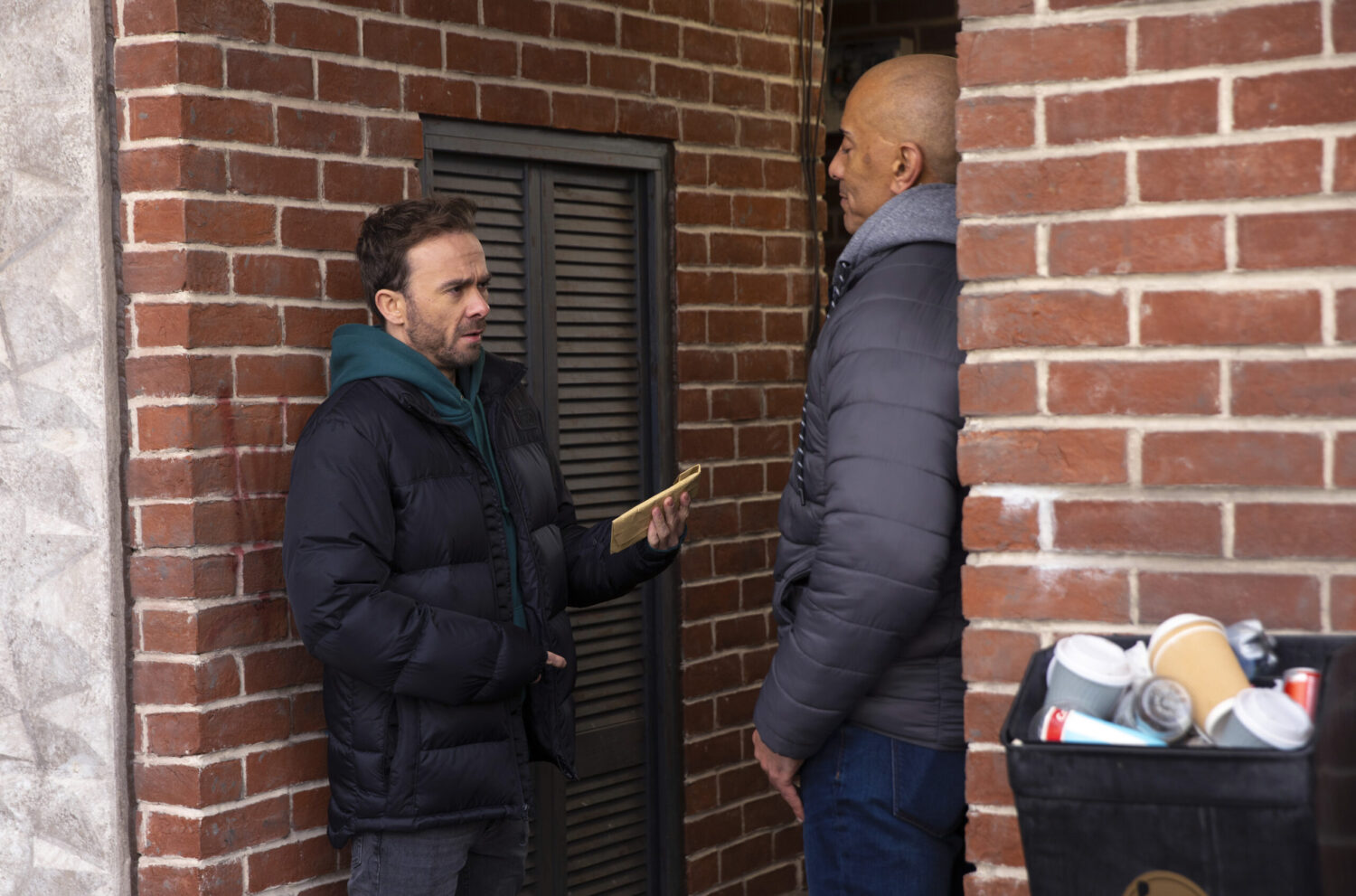 Andy handing David some cash