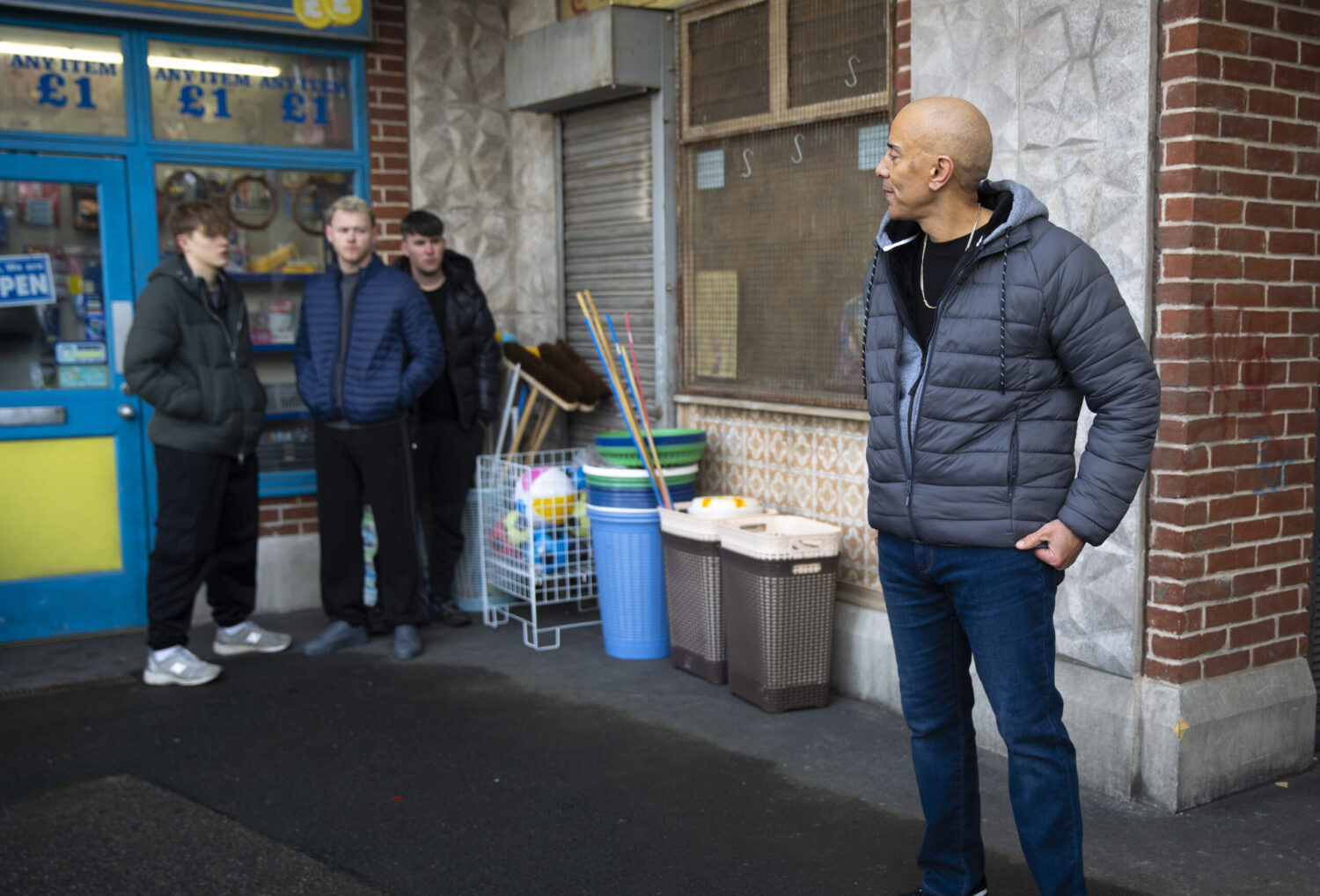 Andy staring at a group of lads at the precinct in Coronation Street spoilers