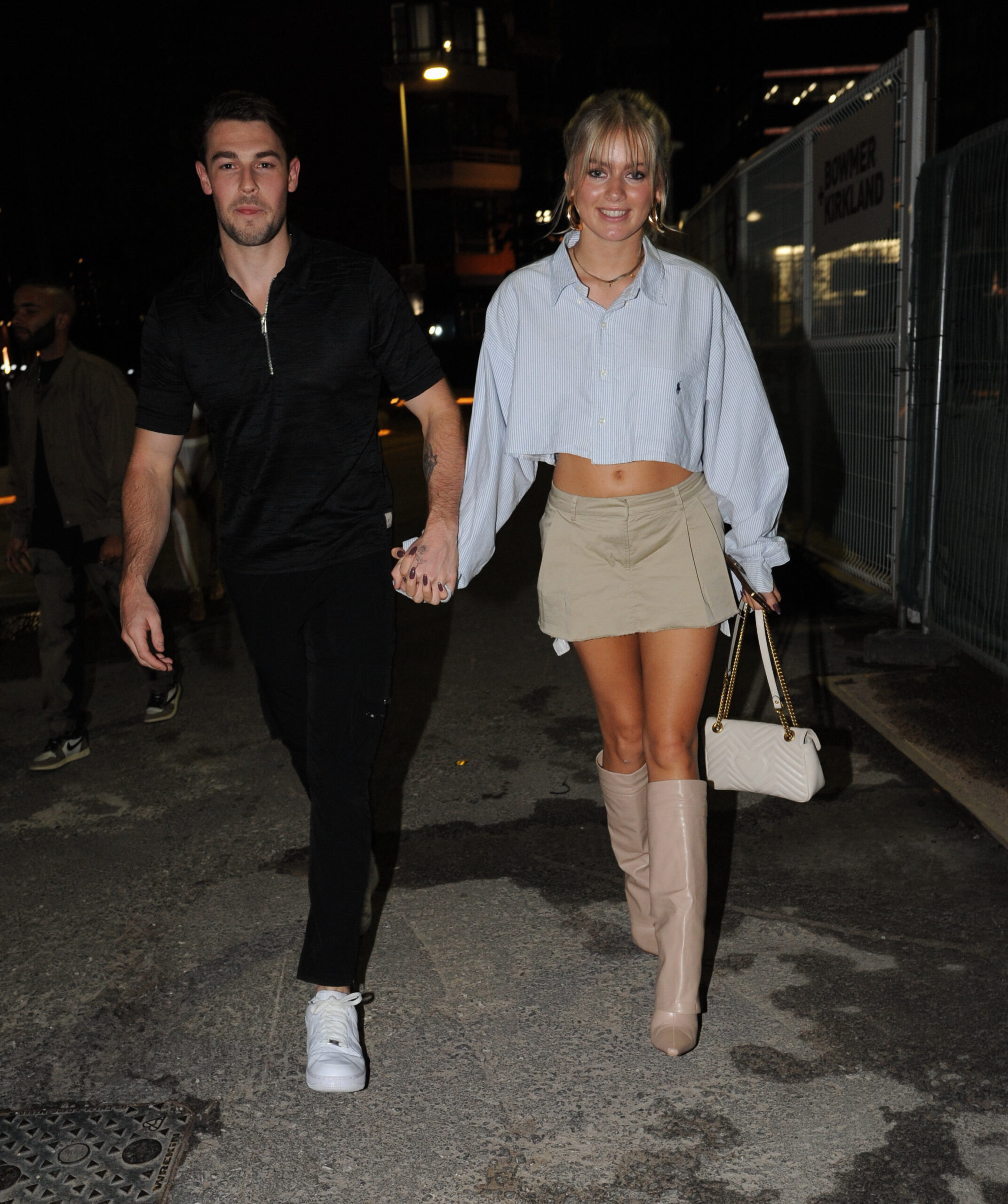 Andrew Le Page and Tasha Ghouri walk hand in hand on street