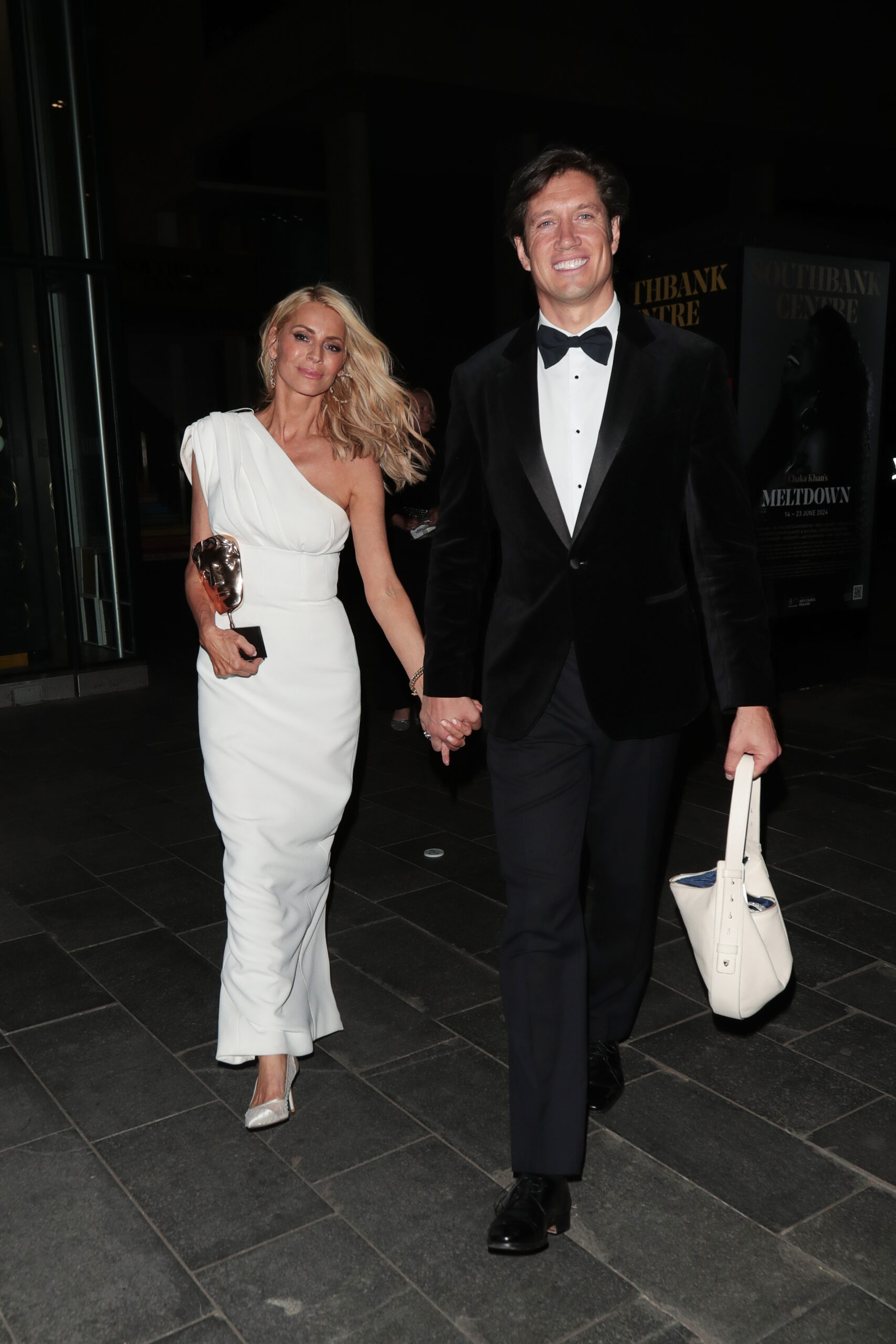 Tess Daly and Vernon Kay walk hand in hand