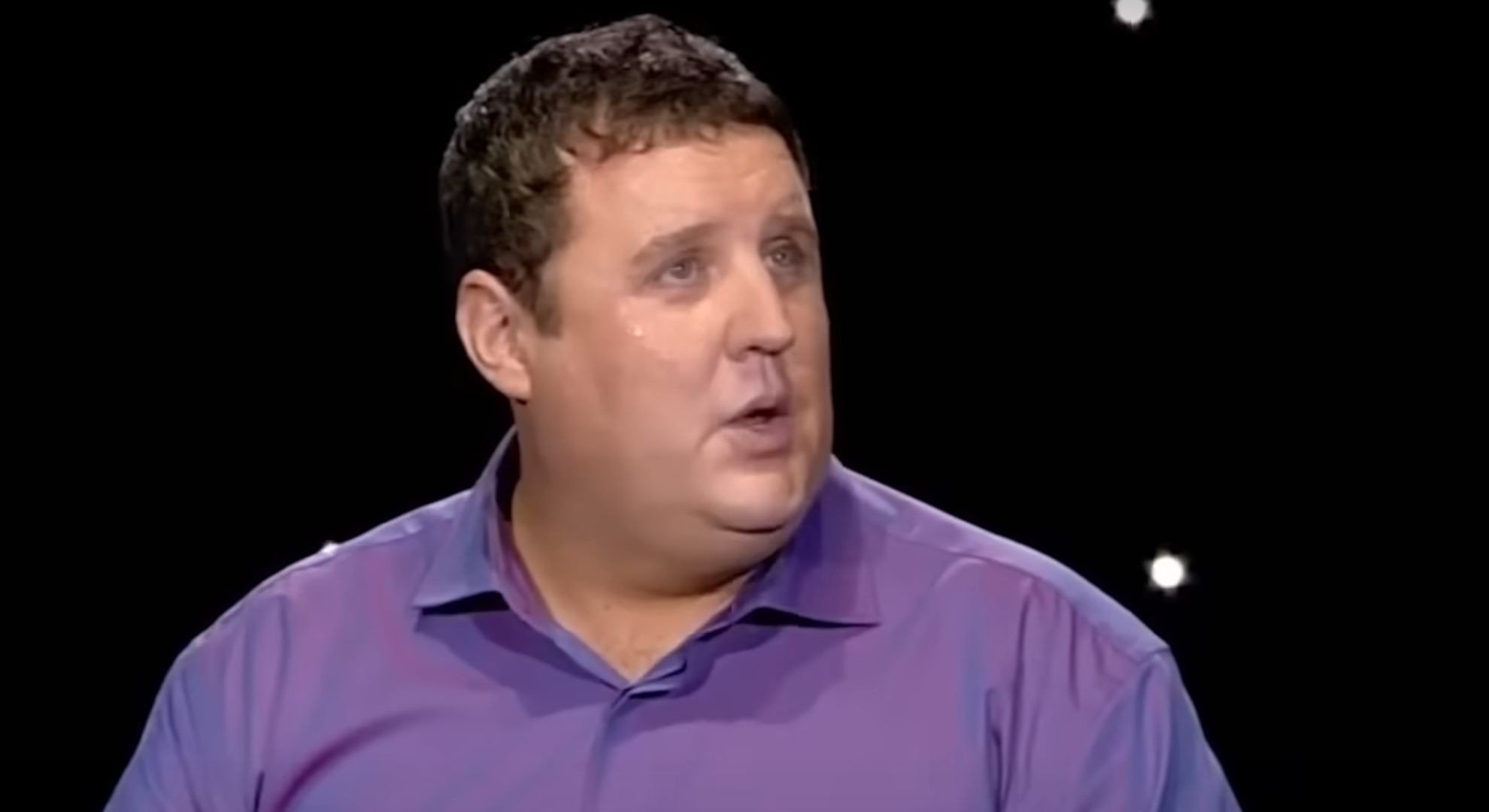 Peter Kay looking to his left 