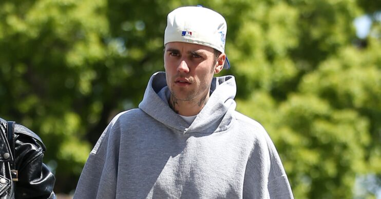 Justin Bieber looks annoyed as he walks outside