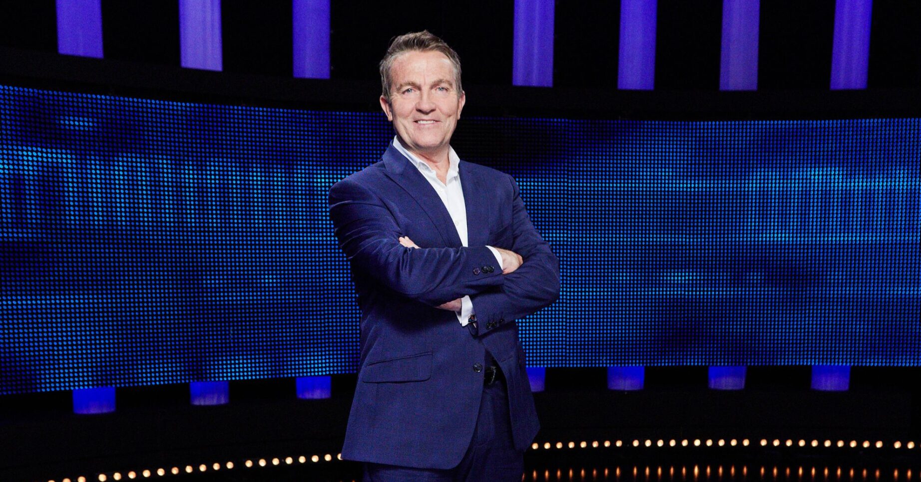 Bradley Walsh in front of generic blue background
