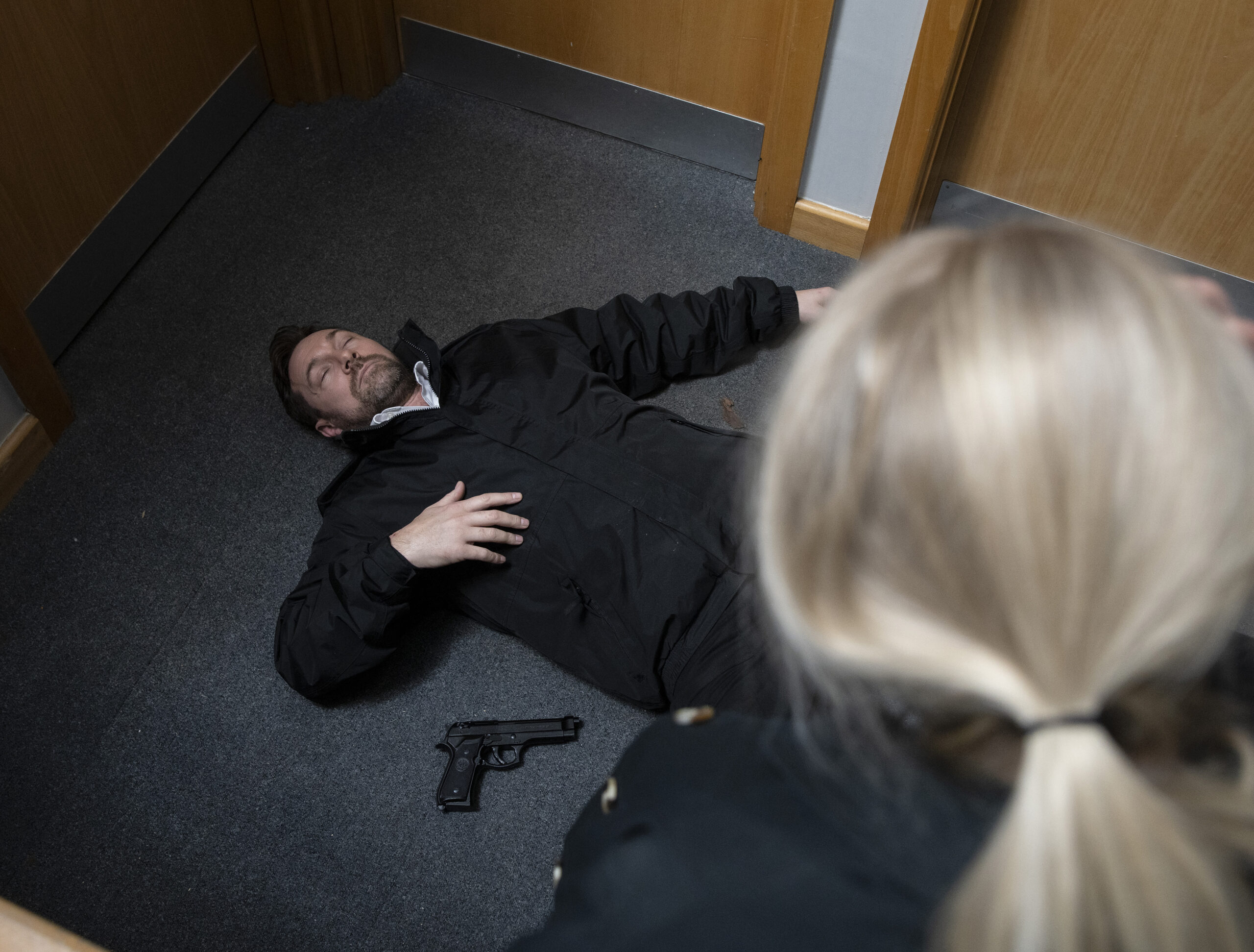 Coronation Street's Rob lying unconscious on the floor with Lisa staring at him