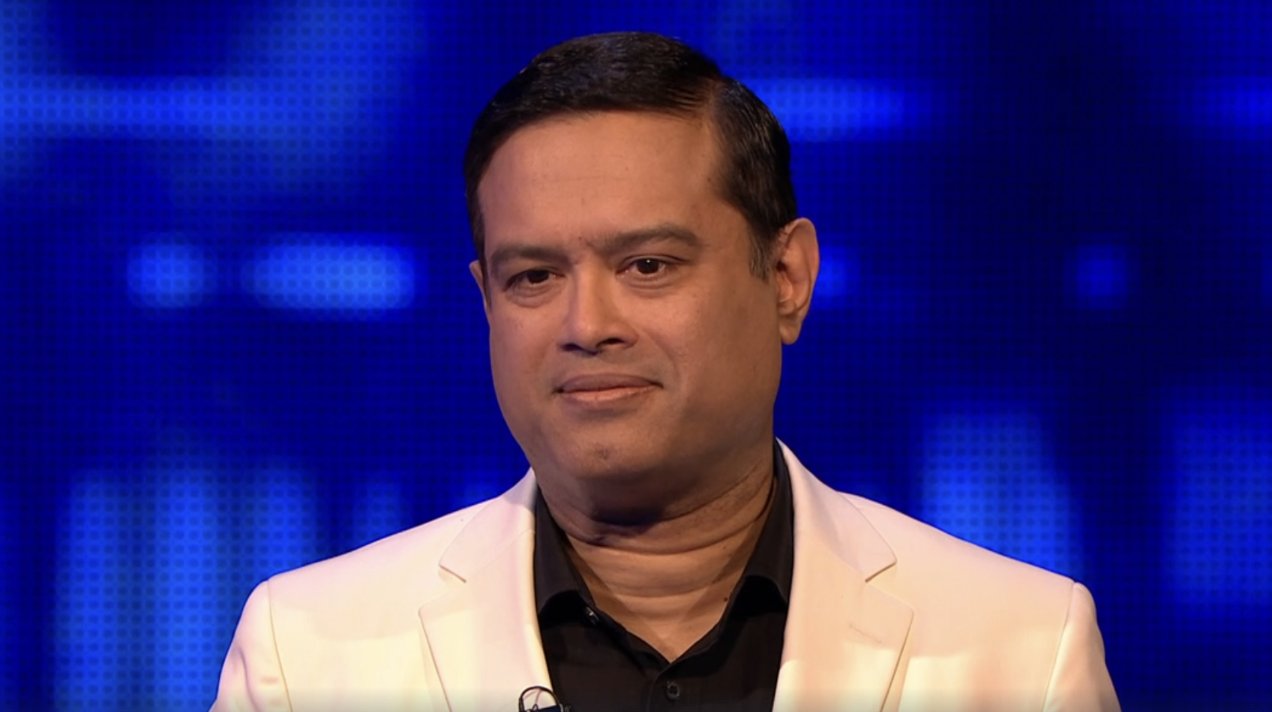 Paul Sinha on The Chase smiling after win