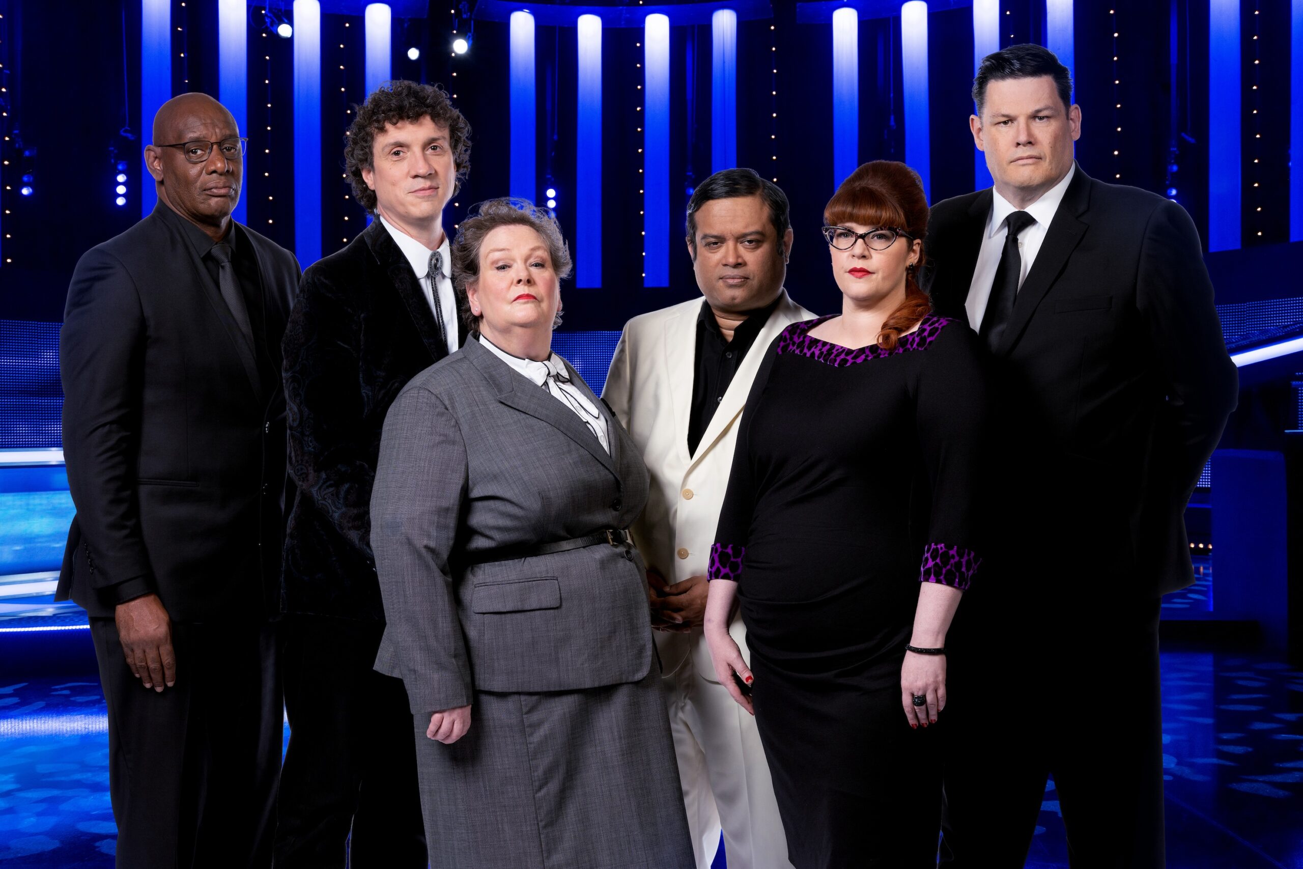 The Chasers against a blue background