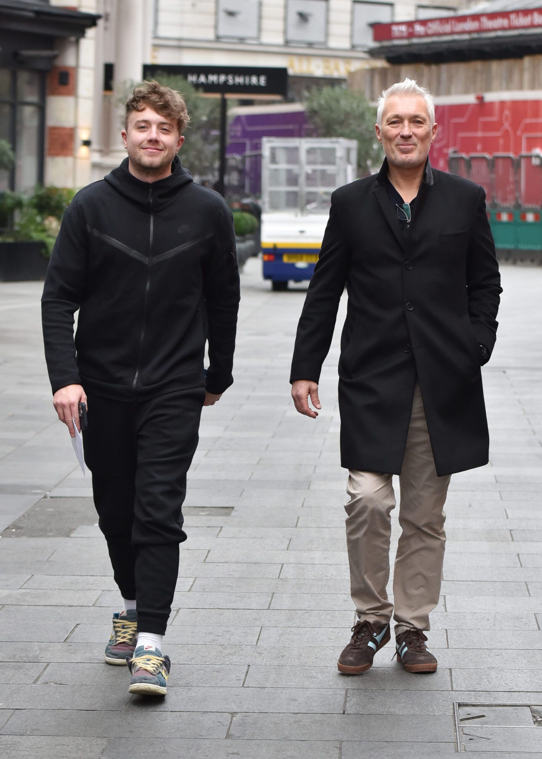 Roman and Martin Kemp walking down the street