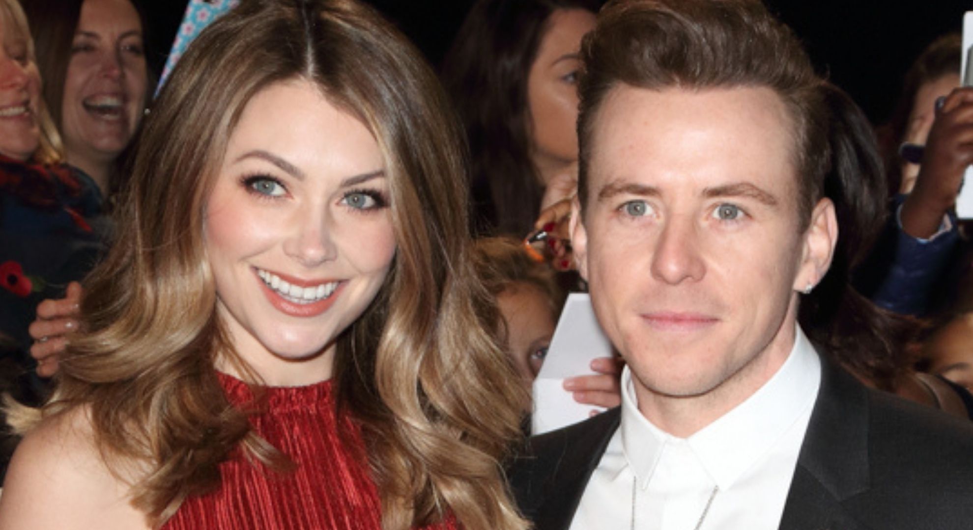 Georgia Jones and Danny Jones smiling on the red carpet 