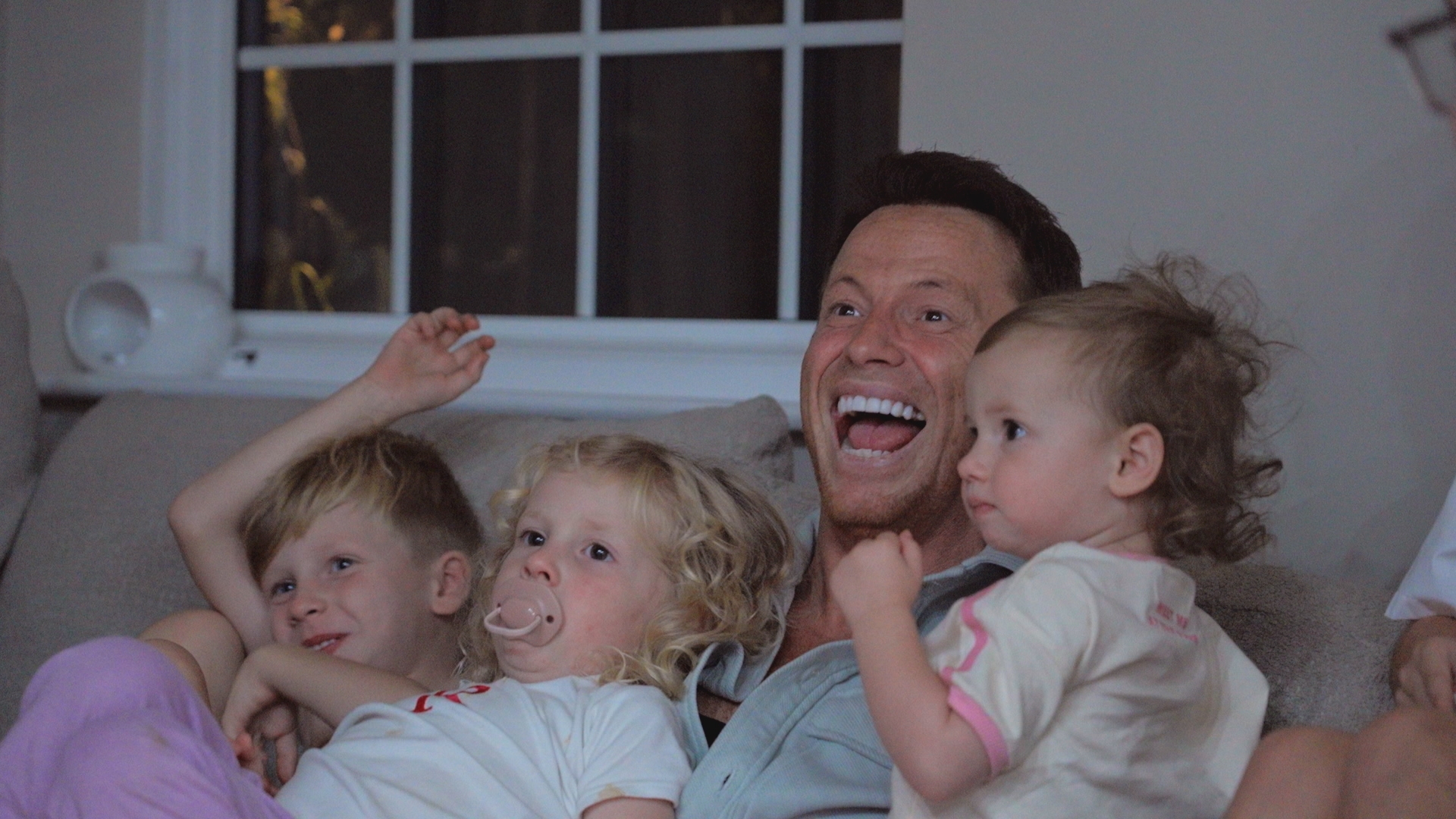 Joe Swash cuddles his children Rex, Rose and Belle