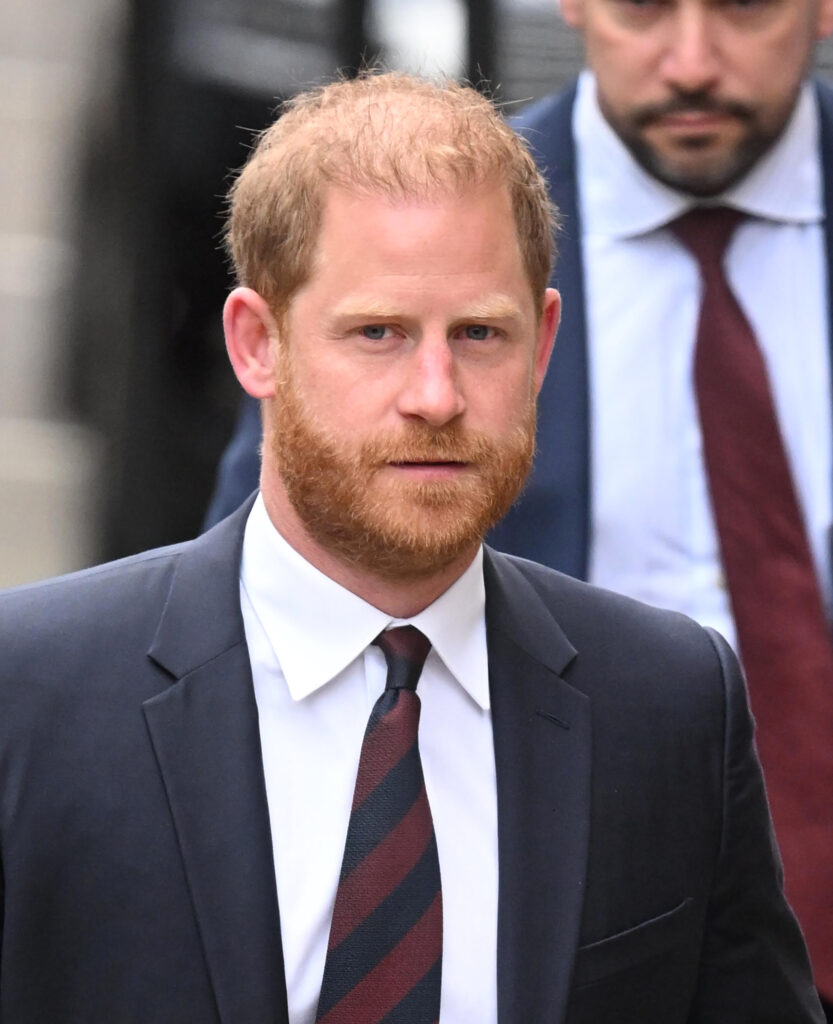 Prince Harry frowning