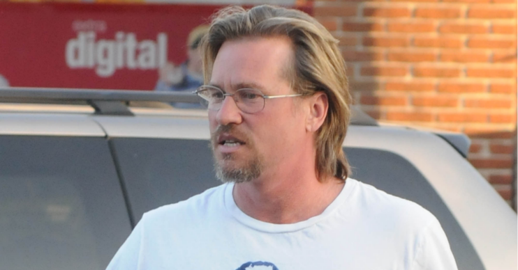 Val Kilmer wearing glasses