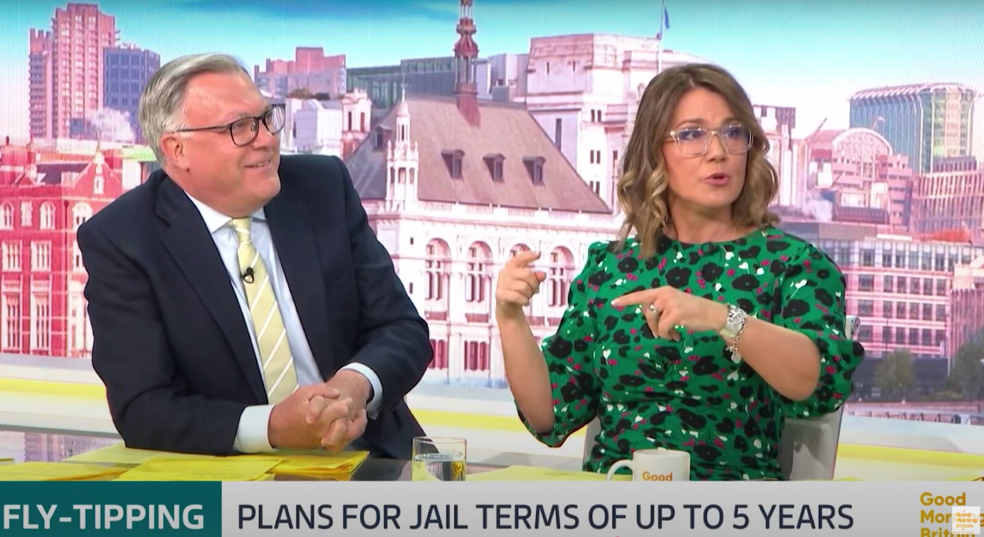 Susanna Reid gestures to a smiling Ed Balls