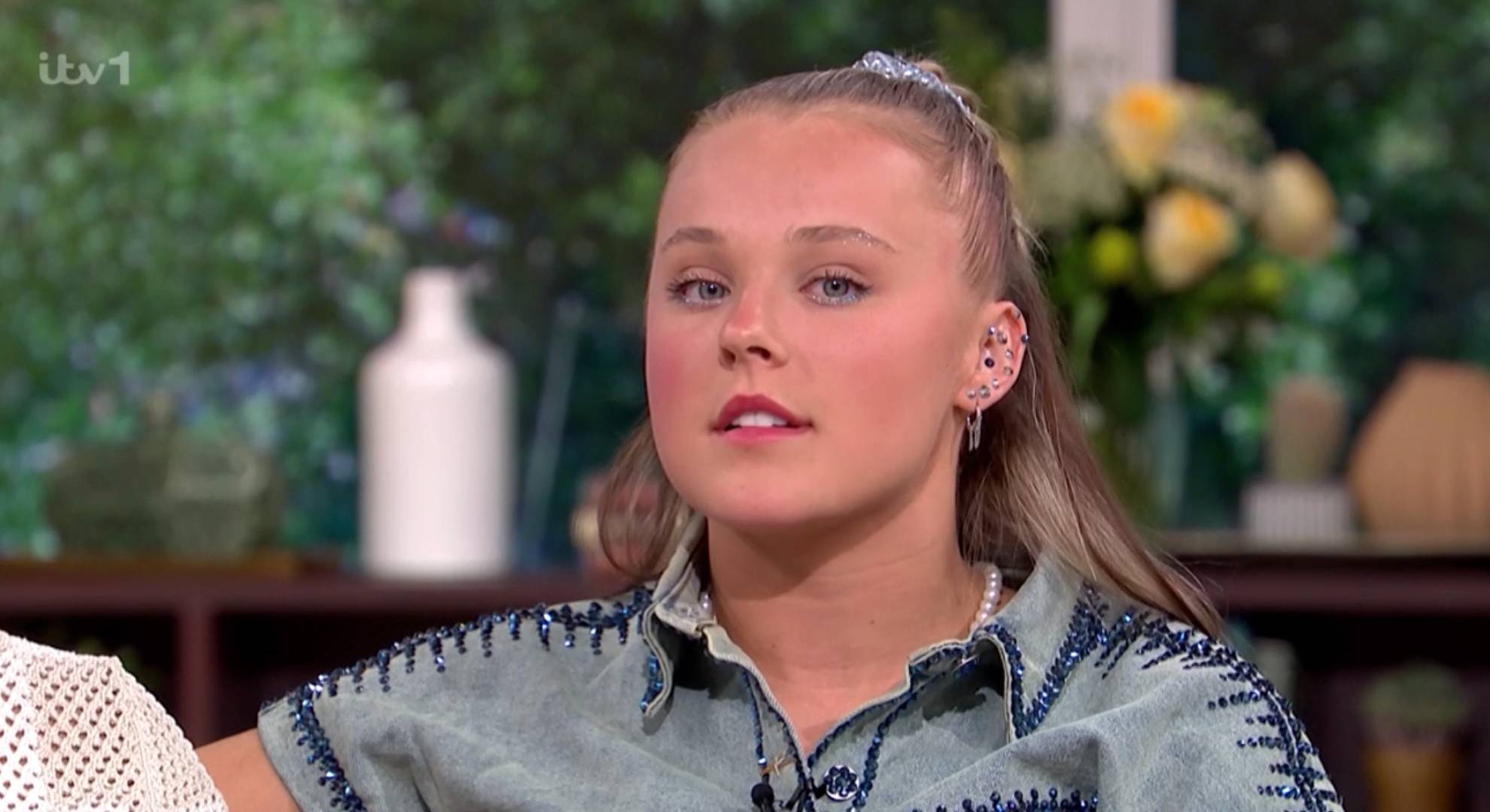 JoJo Siwa looks at the camera