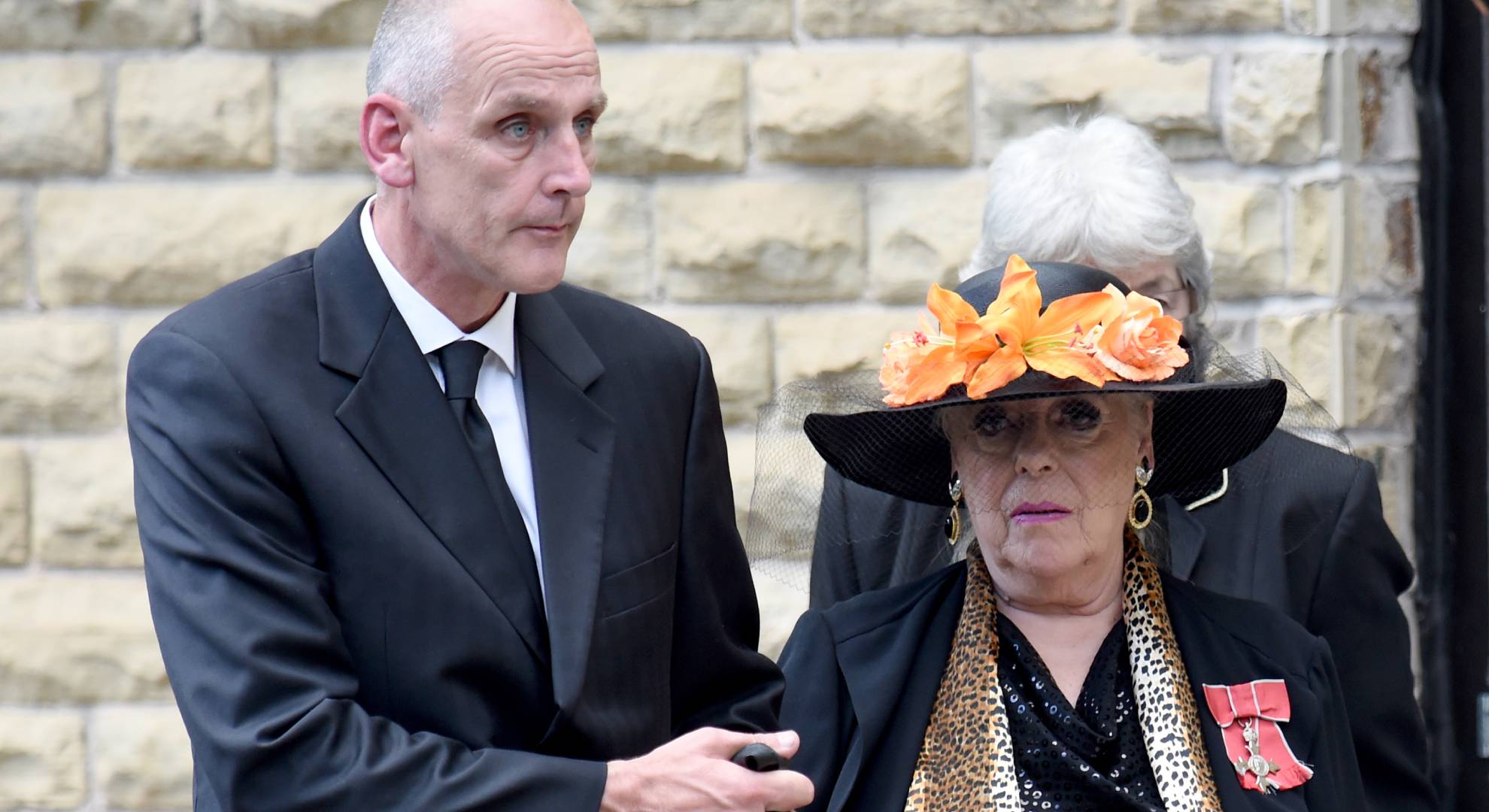 Julie Goodyear is accompanied by husband in 2017