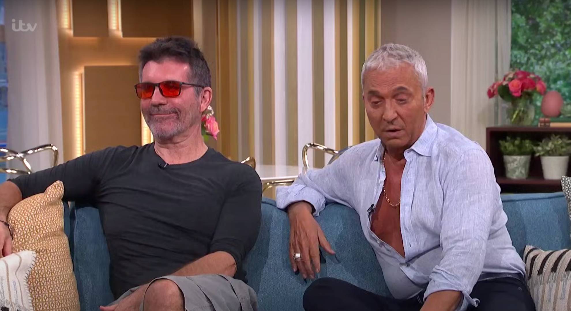 Simon Cowell smiles, Bruno Tonioli looks downwards on This Morning today