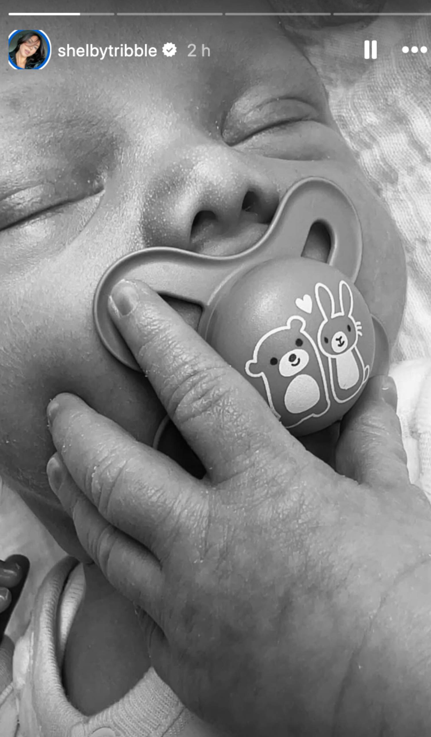 Baby sucks a dummy