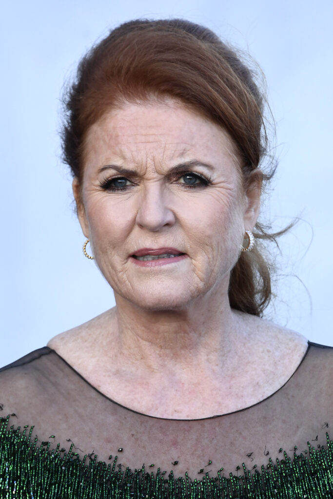 Sarah Ferguson frowning wearing a green dress