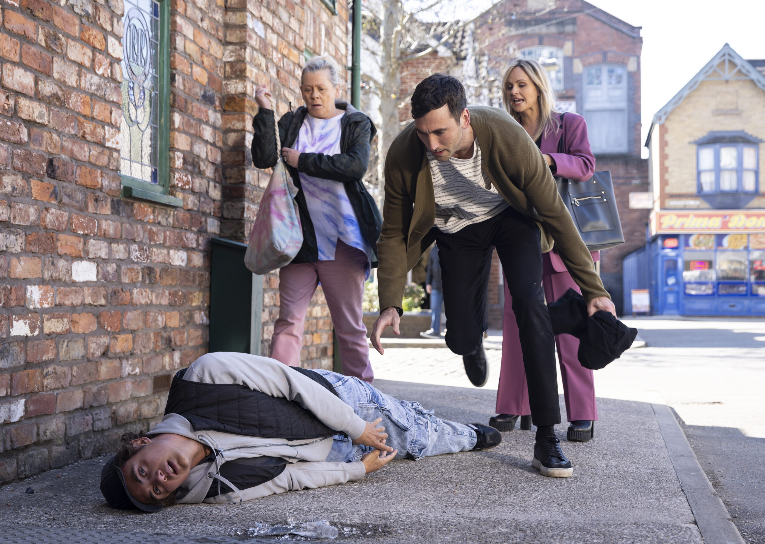 Bernie, Kit, Sarah staring at Brody on the floor