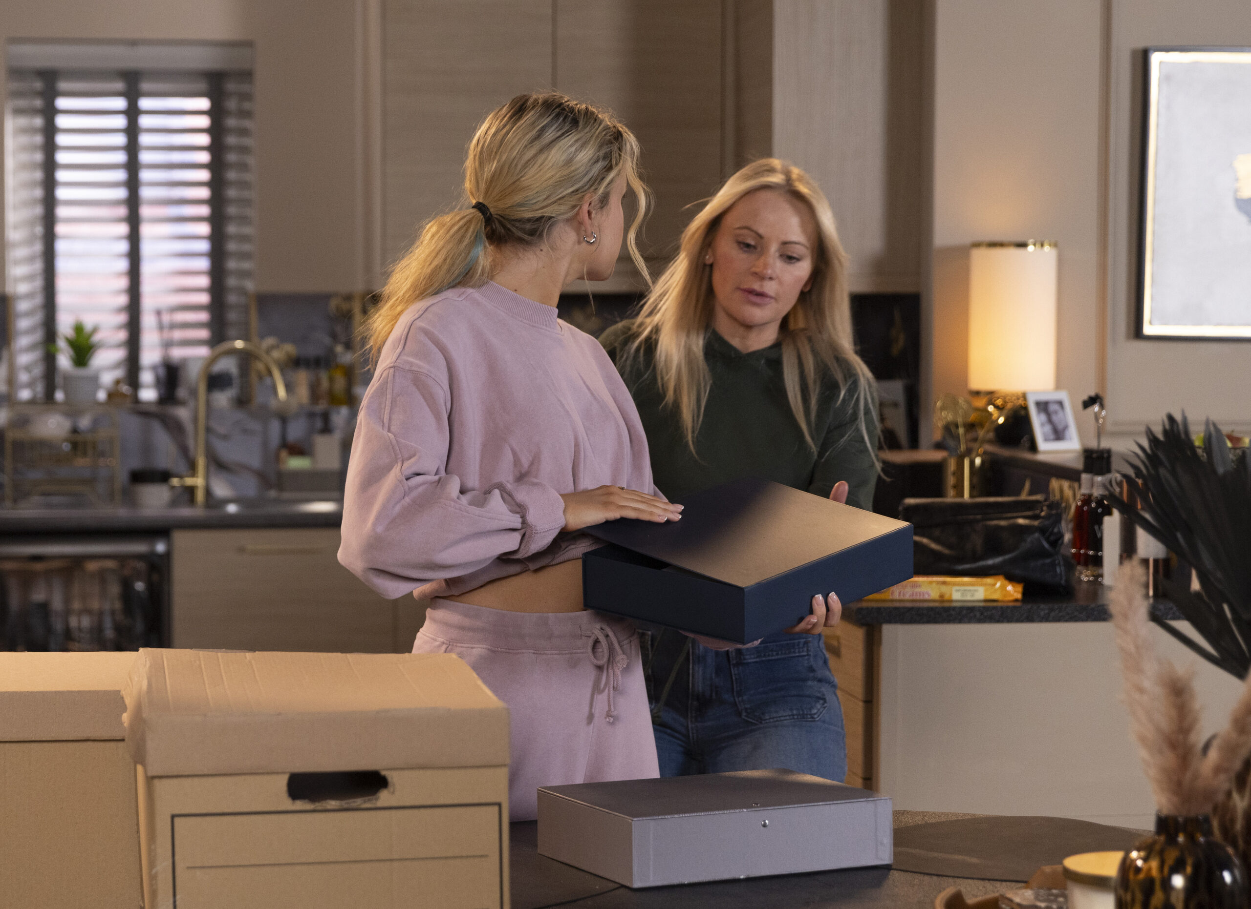 Lisa and Betsy looking through files in Coronation Street