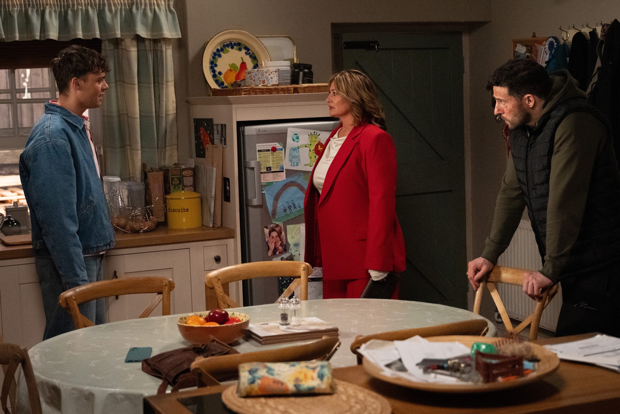 Lewis talking to Moira and Ross in Emmerdale