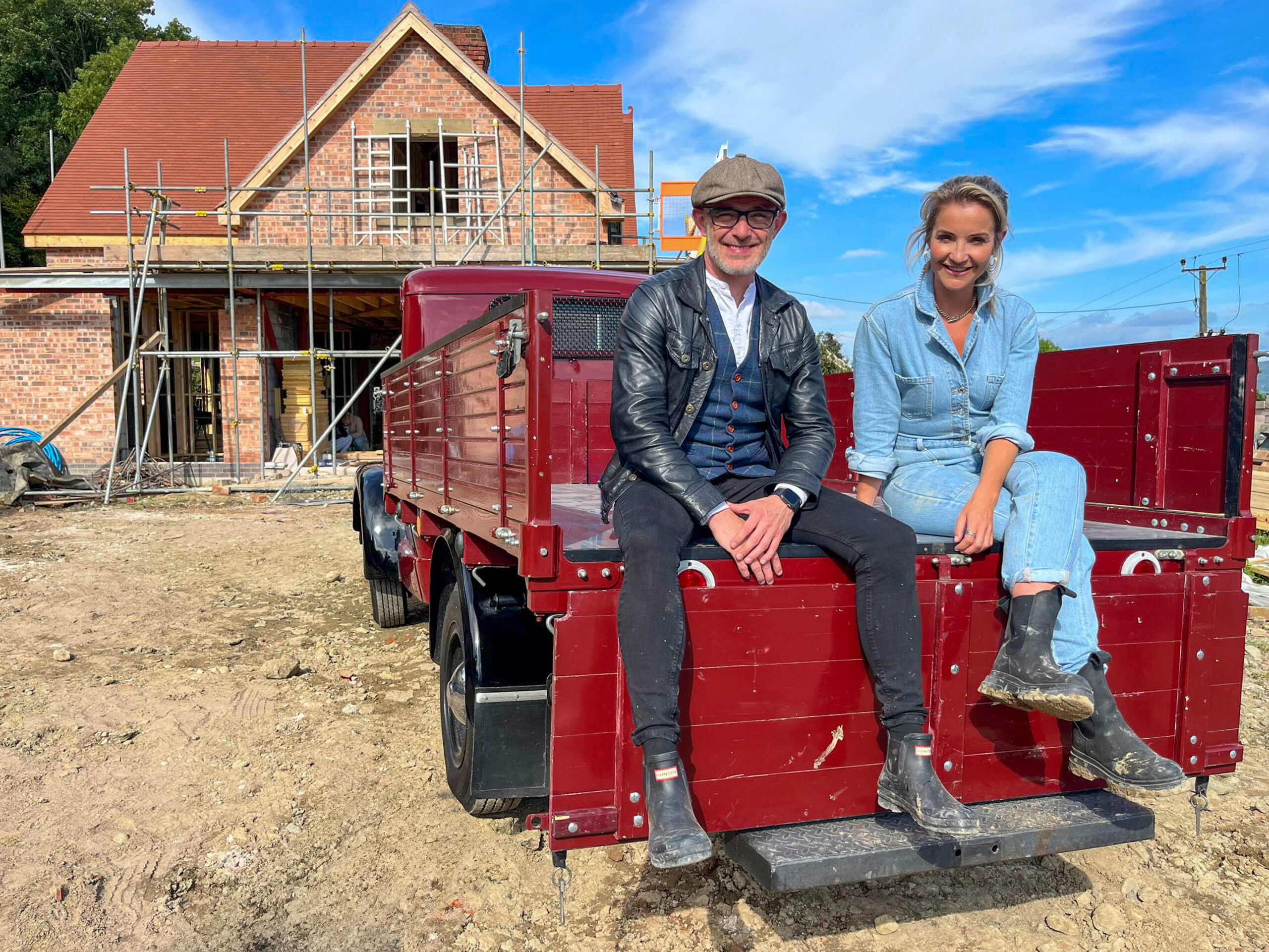 Patrick and Helen Skelton sitting on a digger