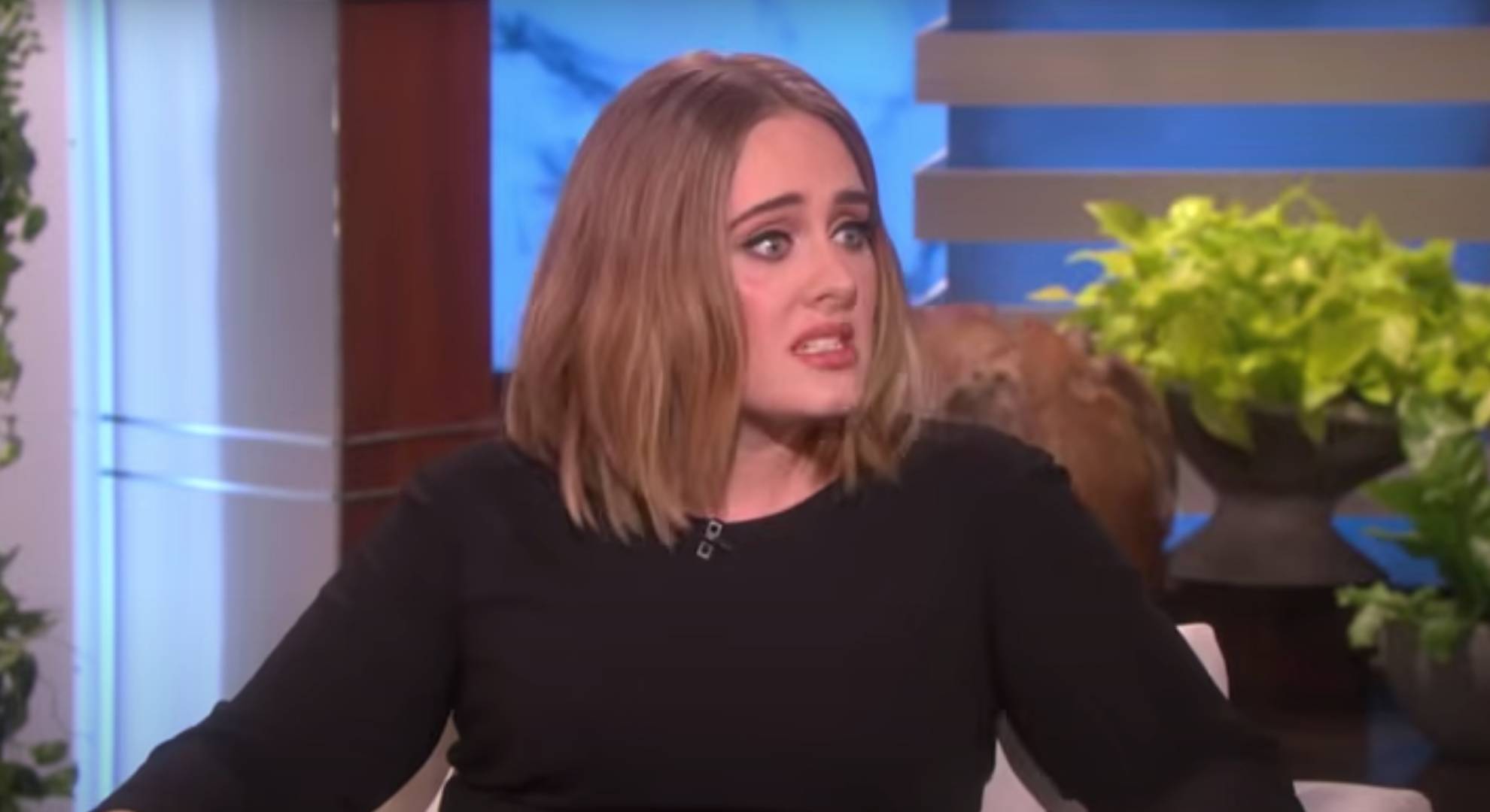 Adele grimaces