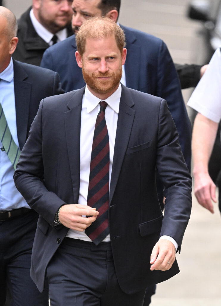 Prince Harry after he lost his court case in black suit