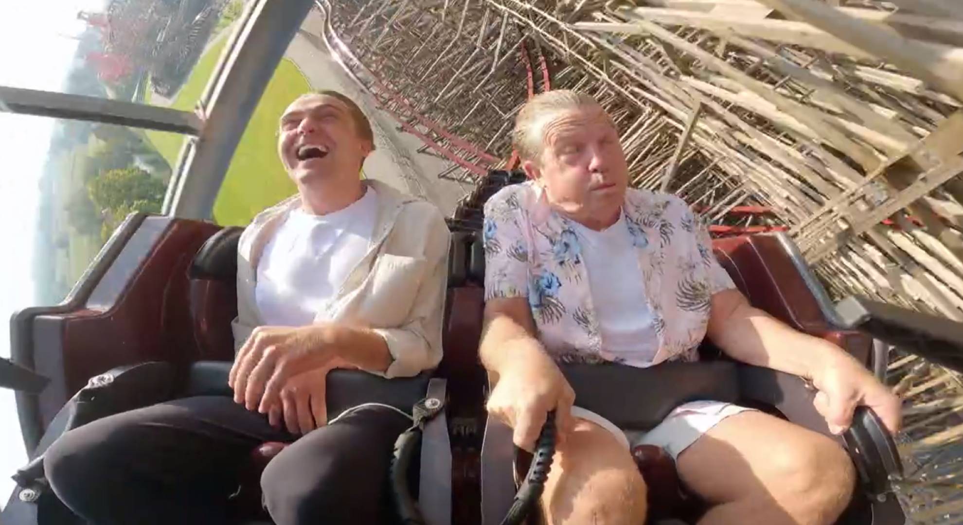 Barney Walsh and Bradley Walsh ride a rollercoaster