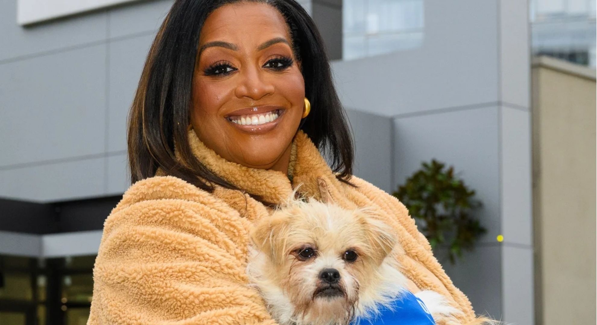 Alison Hammond smiling with dog