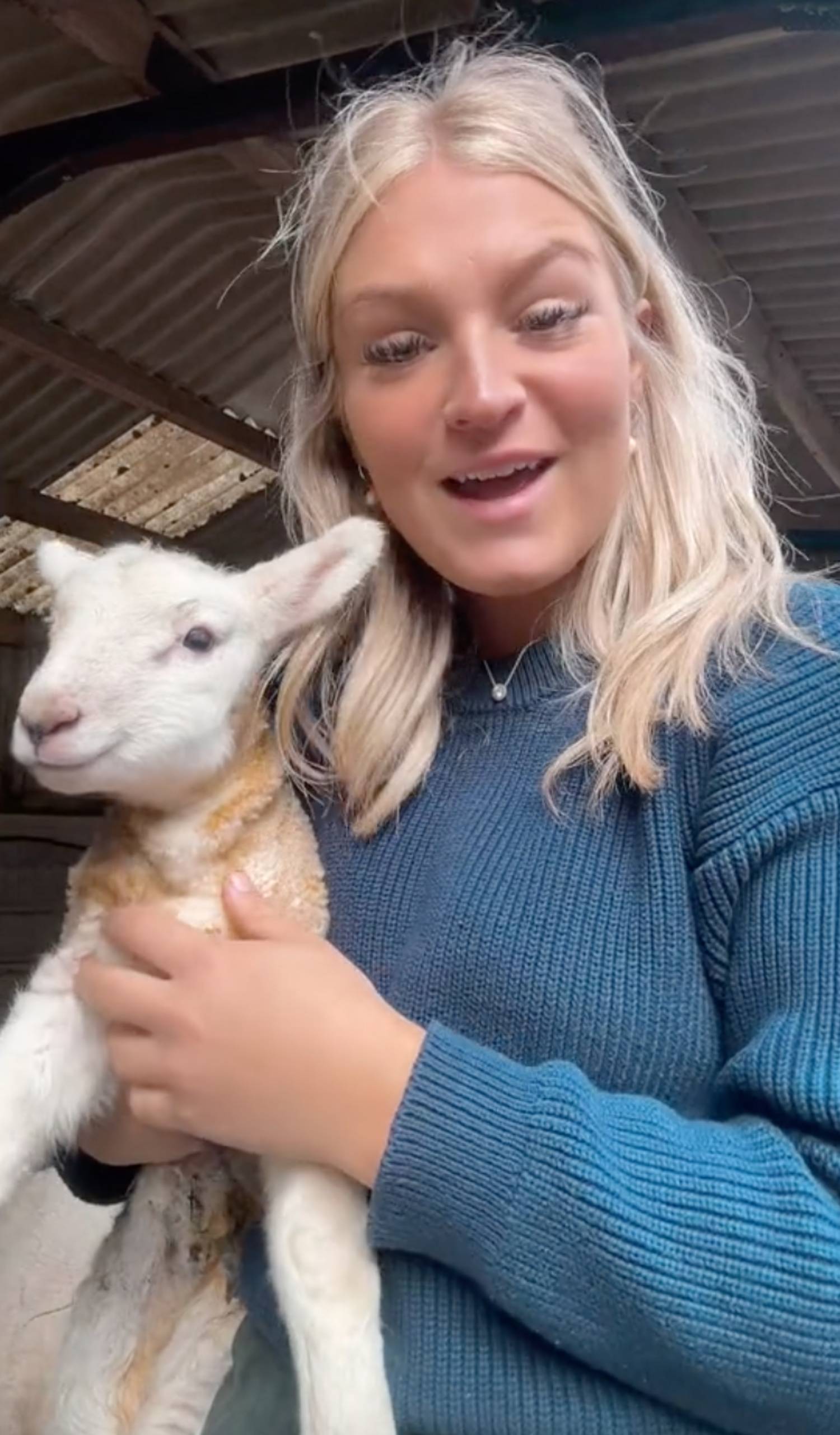 Harriet Cowan holding a lamb
