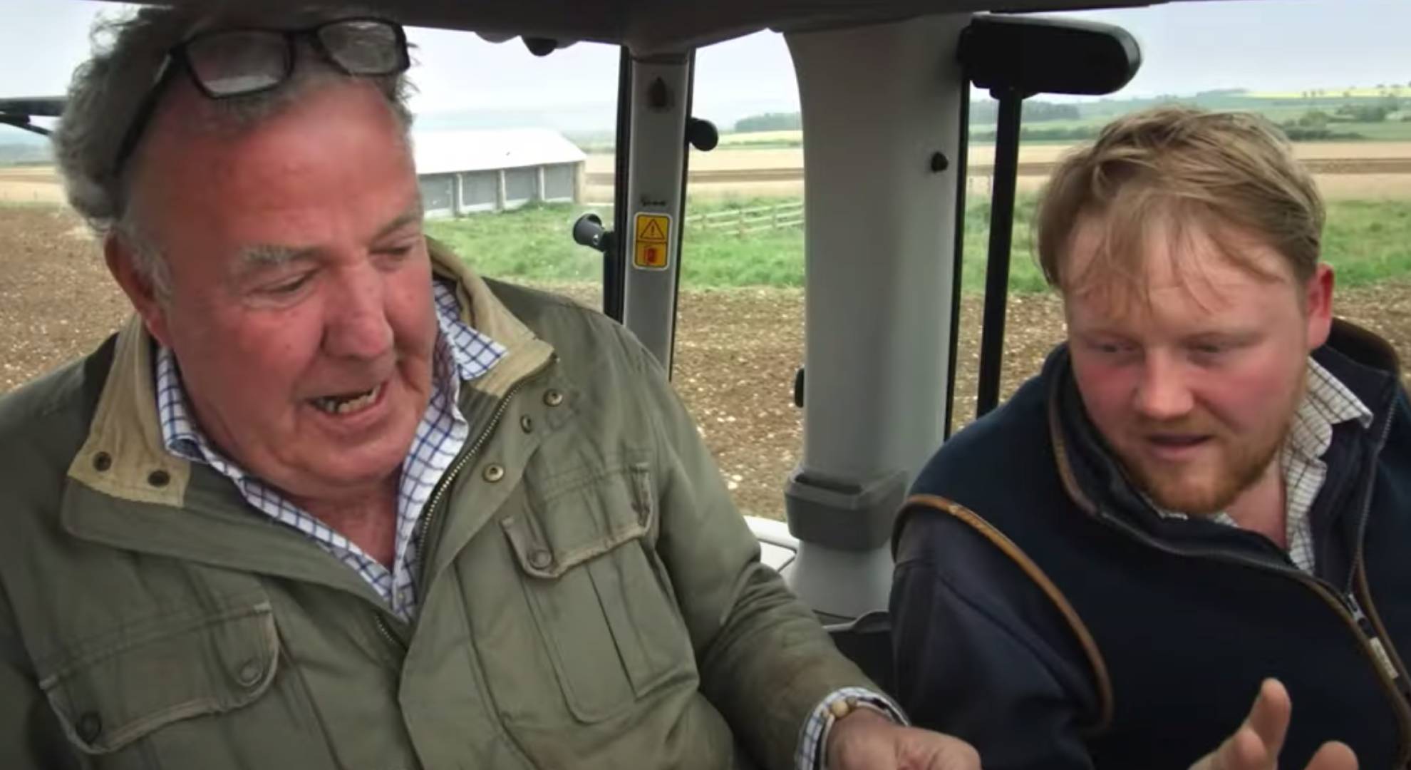 Jeremy Clarkson and Kaleb Cooper driving a tractor